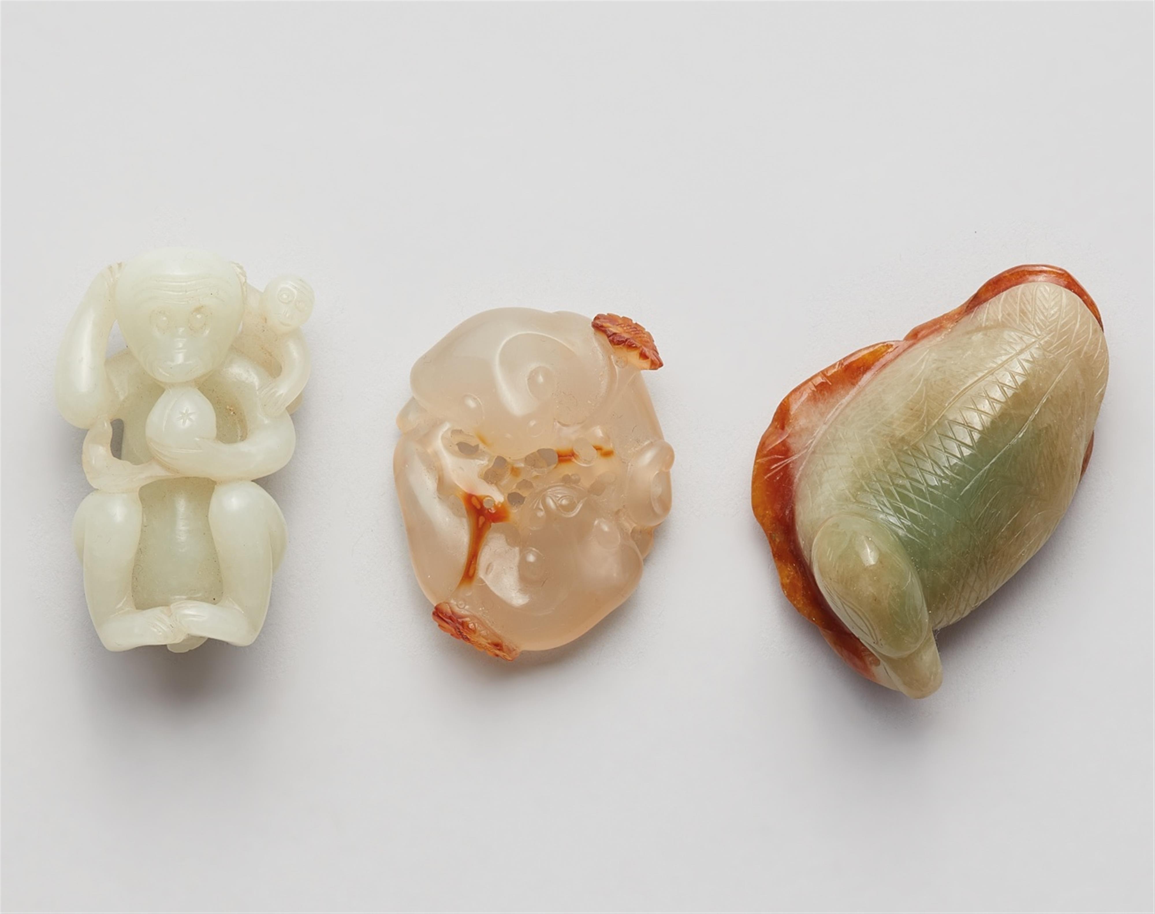 A set of three jade carvings: A monkey, a pair of cats and a duck - image-1