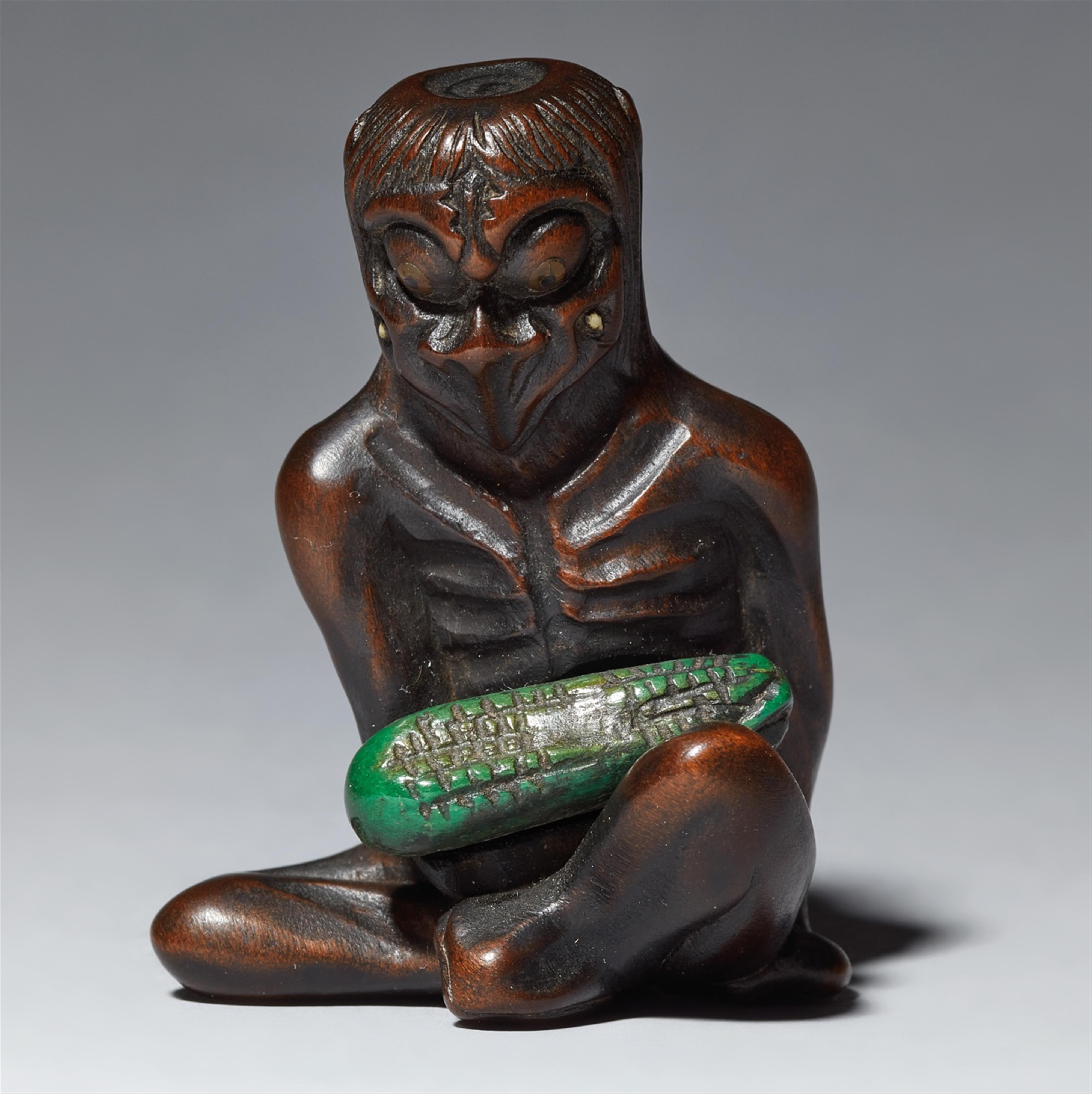 A wood and ivory netsuke of a kappa with a cucumber. 19th century - image-1