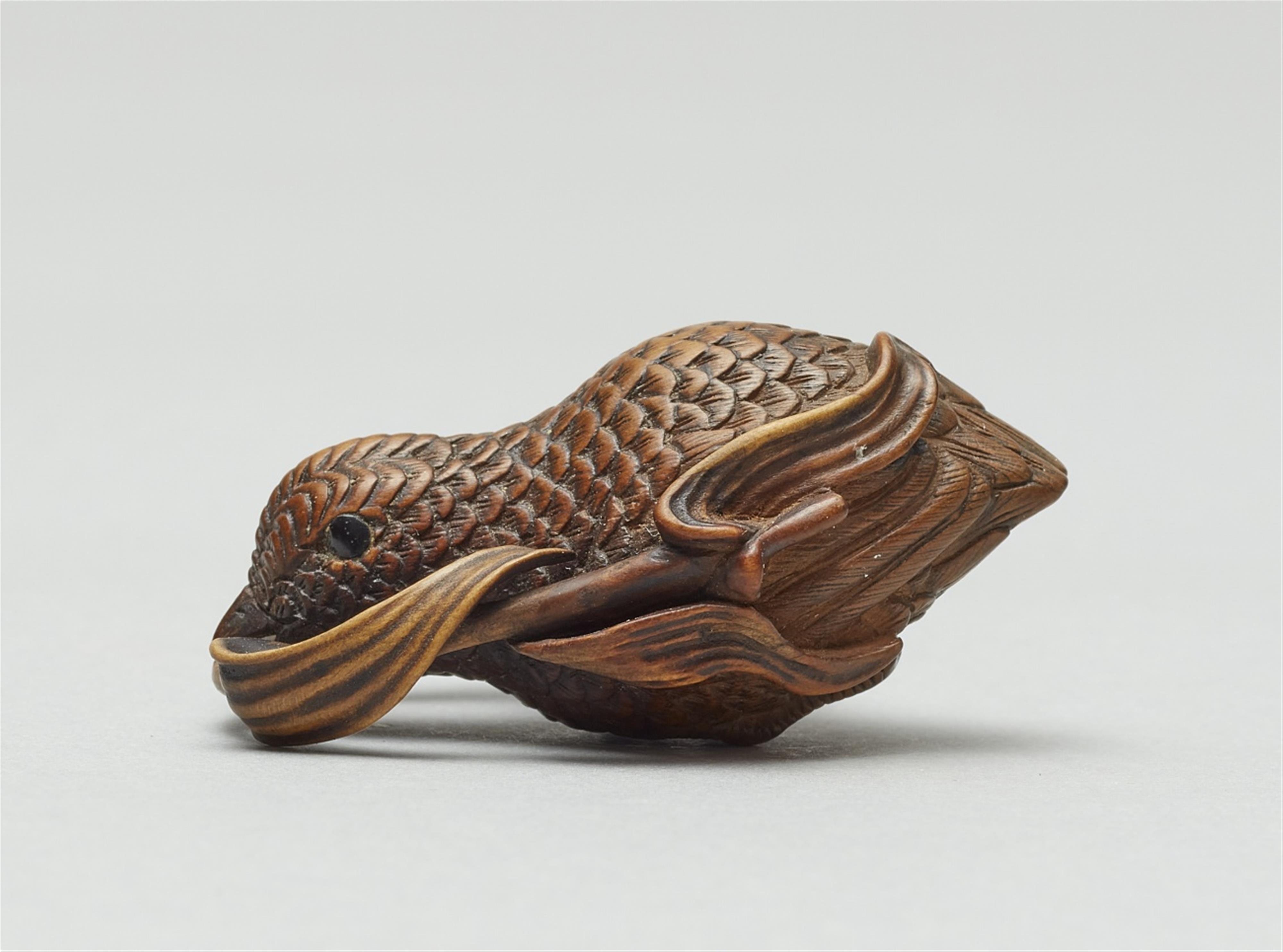 A boxwood netsuke of a flying quail with a millet branch - image-2