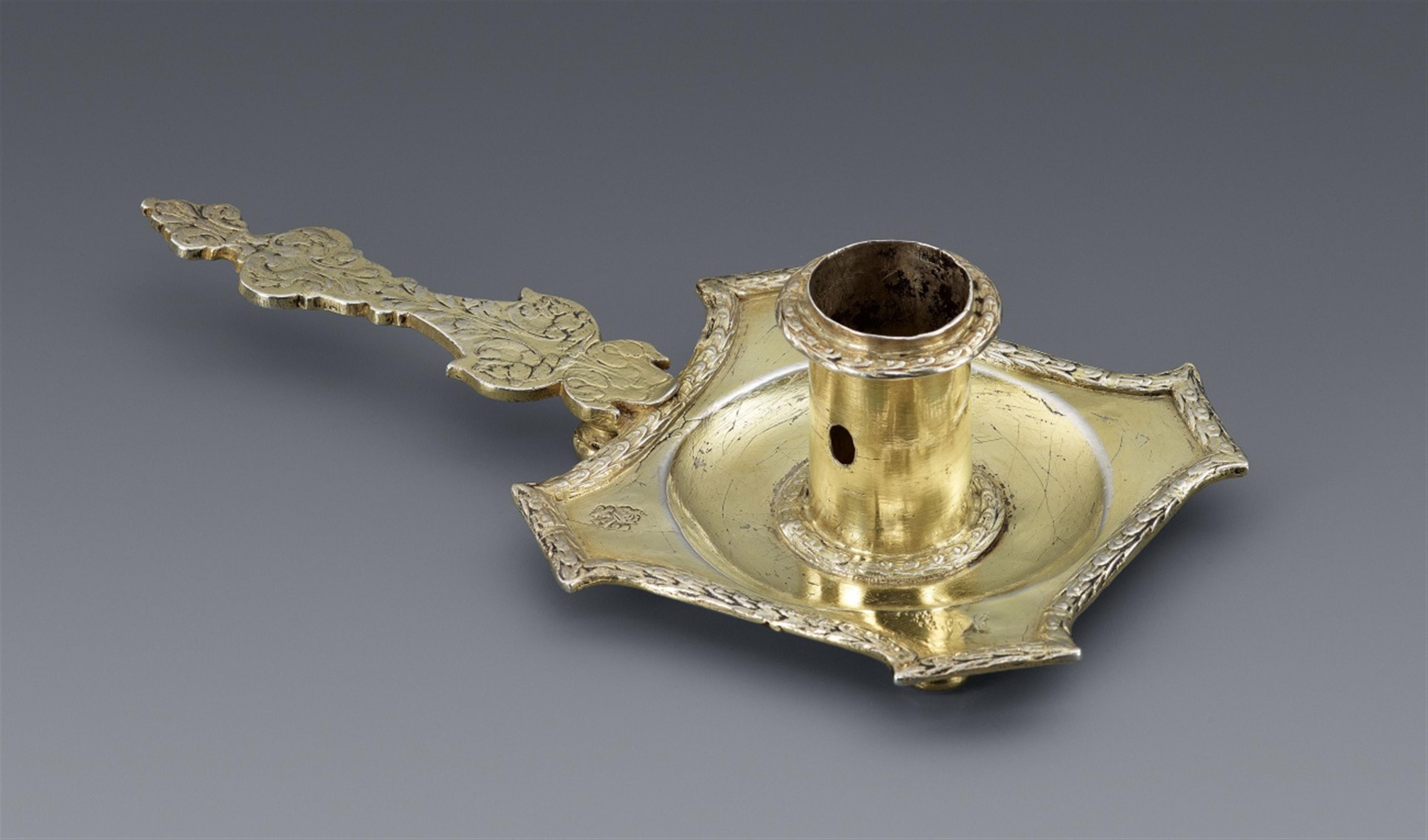 An early Parisian silver gilt chamberstick - image-1