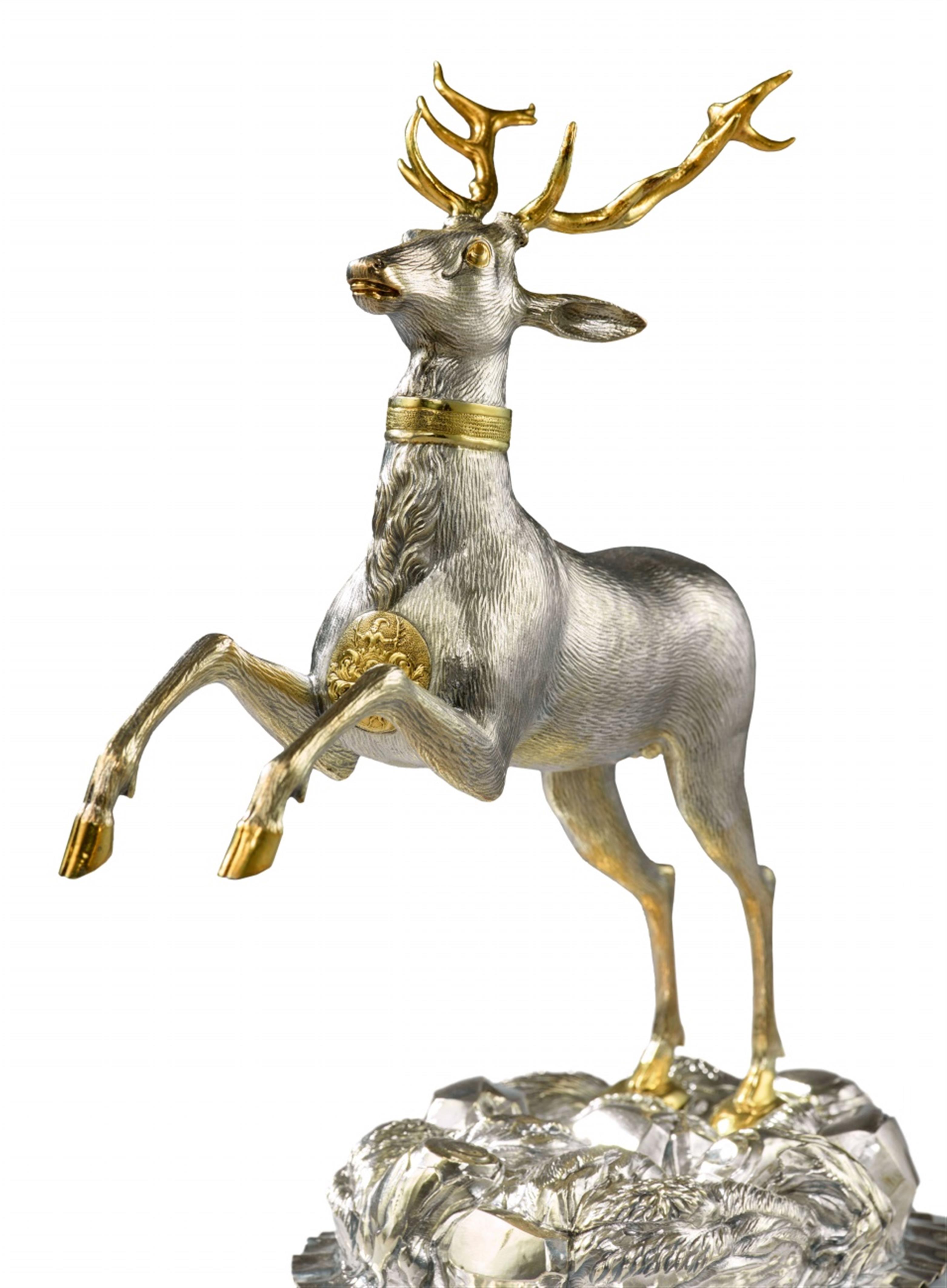 A parcel gilt silver drinking vessel in the form of a stag - image-2
