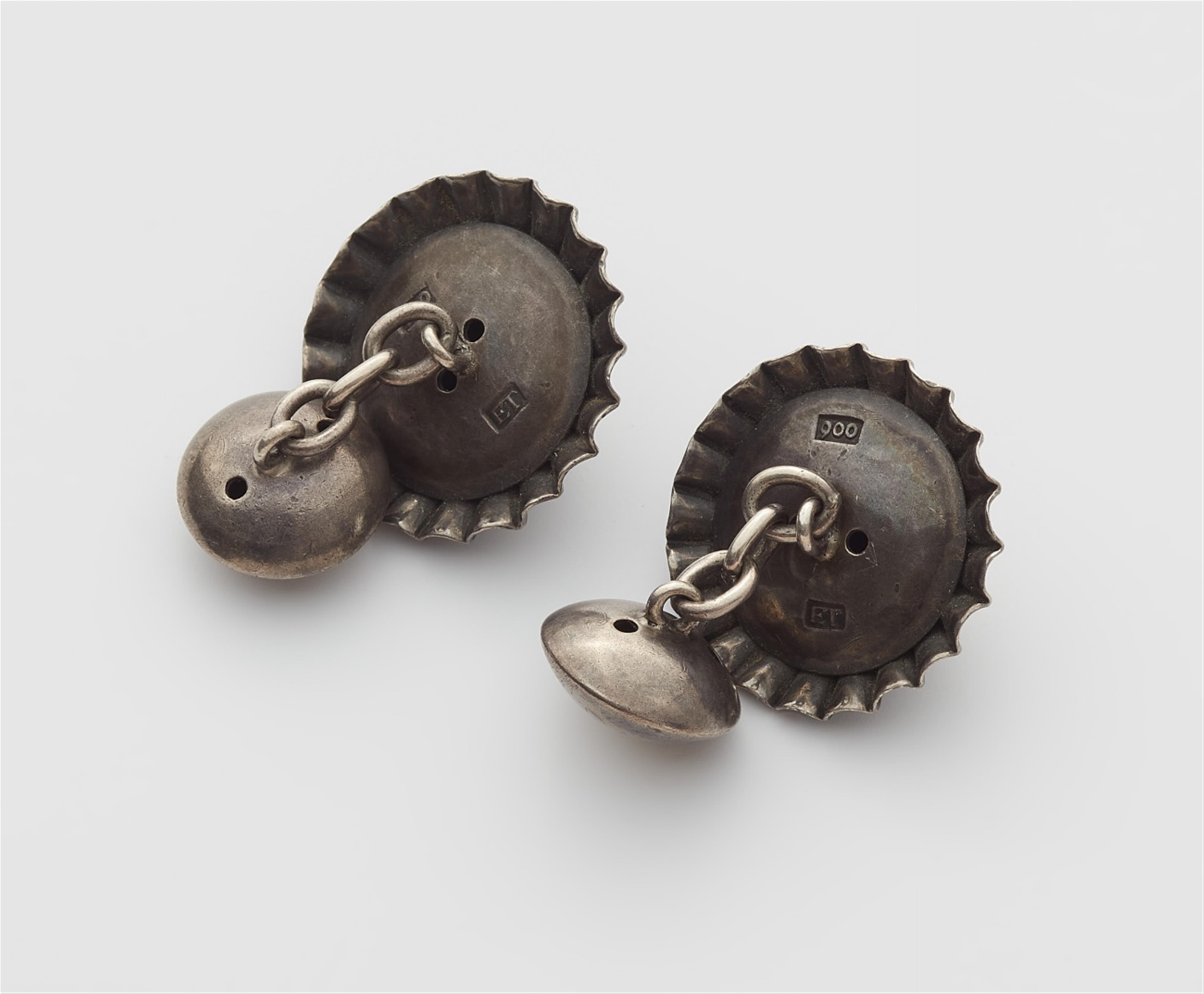 A pair of silver cufflinks - image-2