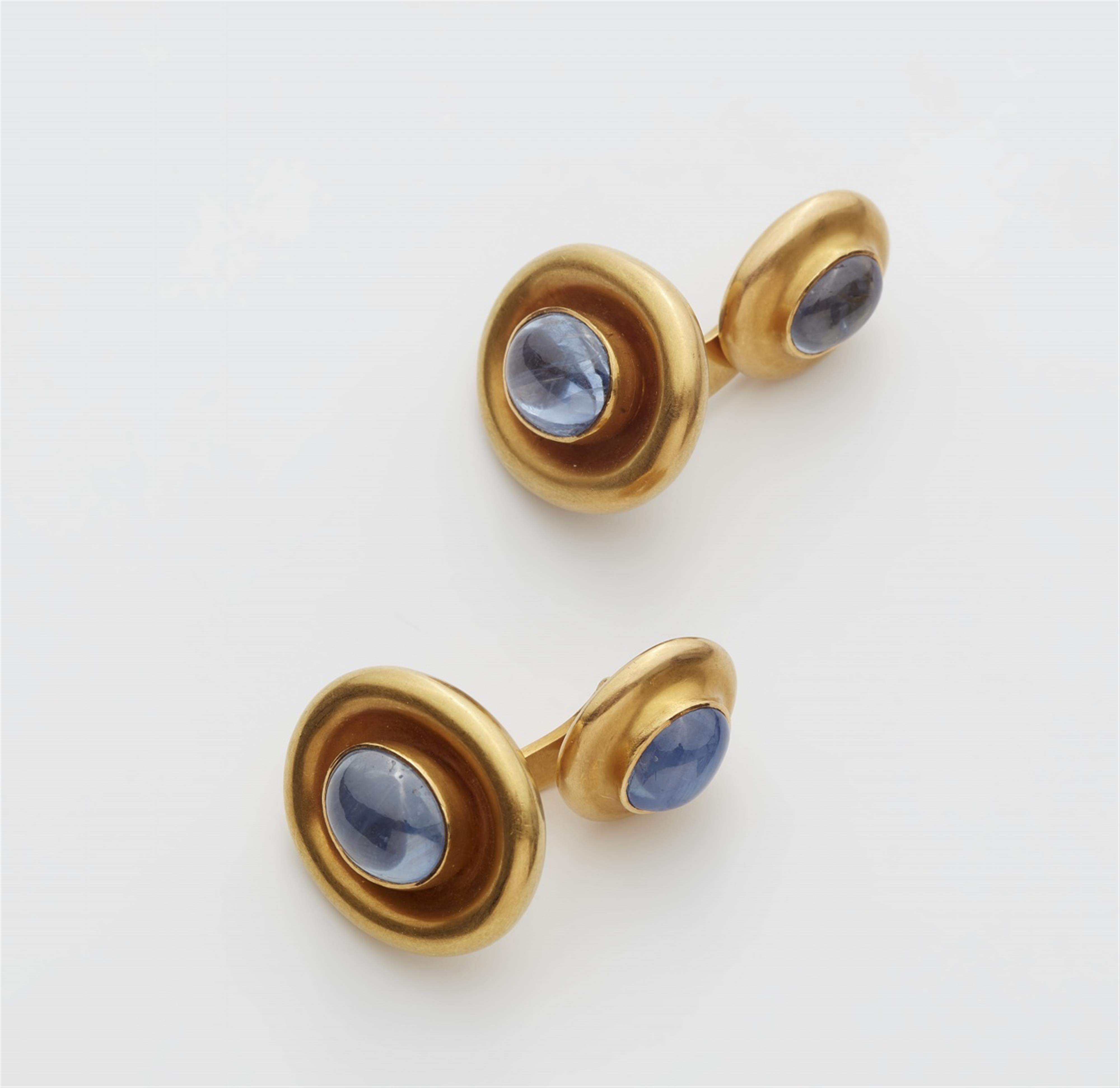 A pair of 18k gold sapphire cufflinks - image-1
