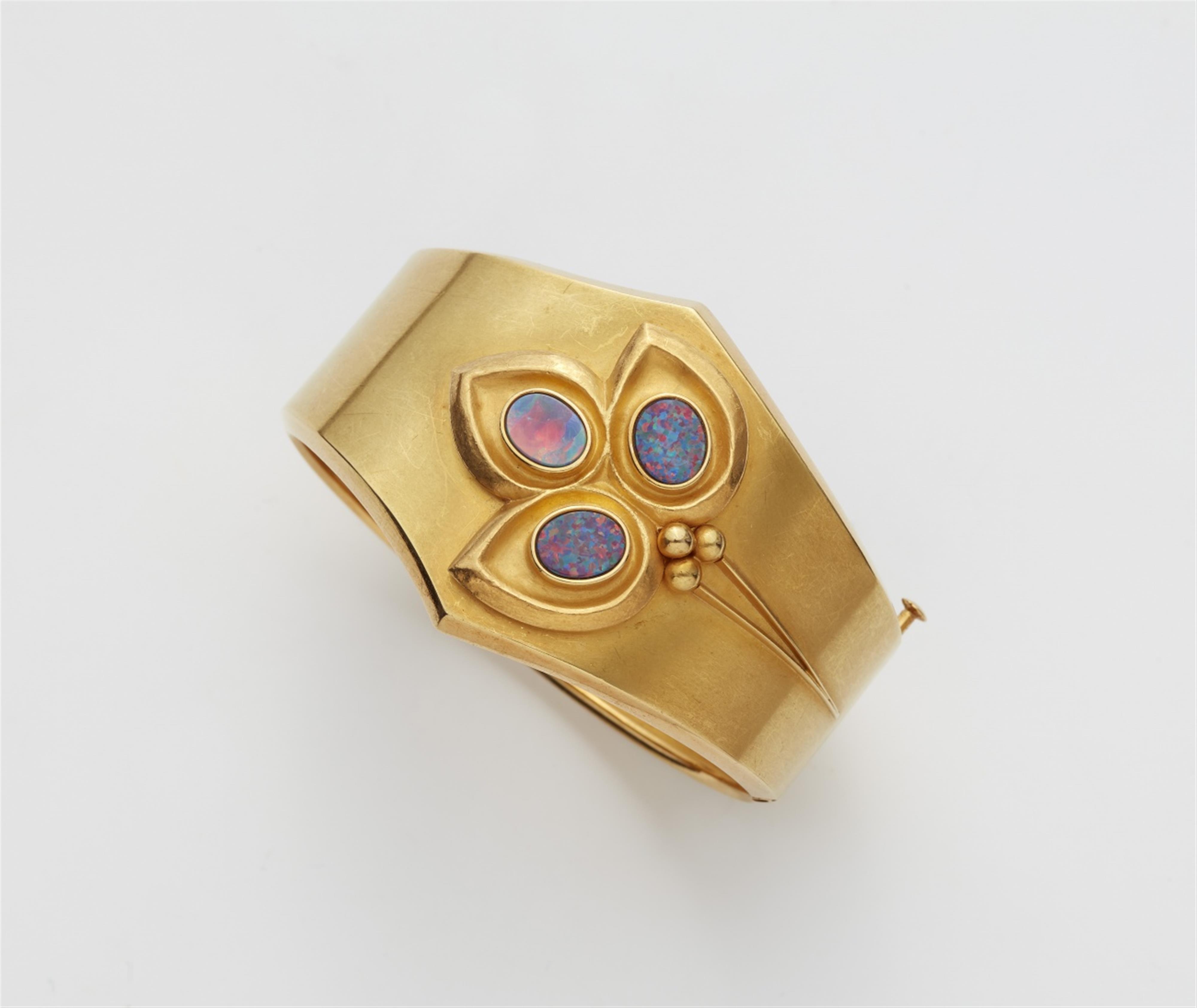 An 18k gold opal bangle - image-1