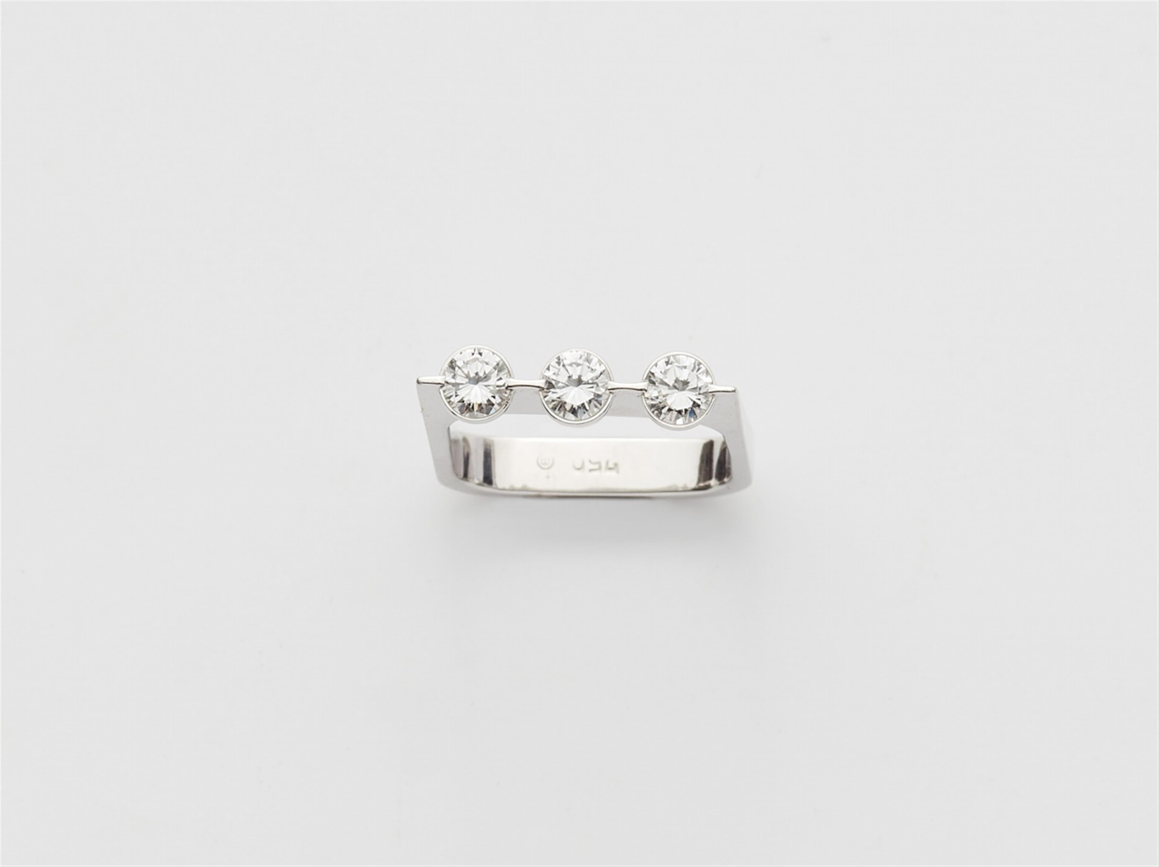 An 18k white gold trinity ring - image-1