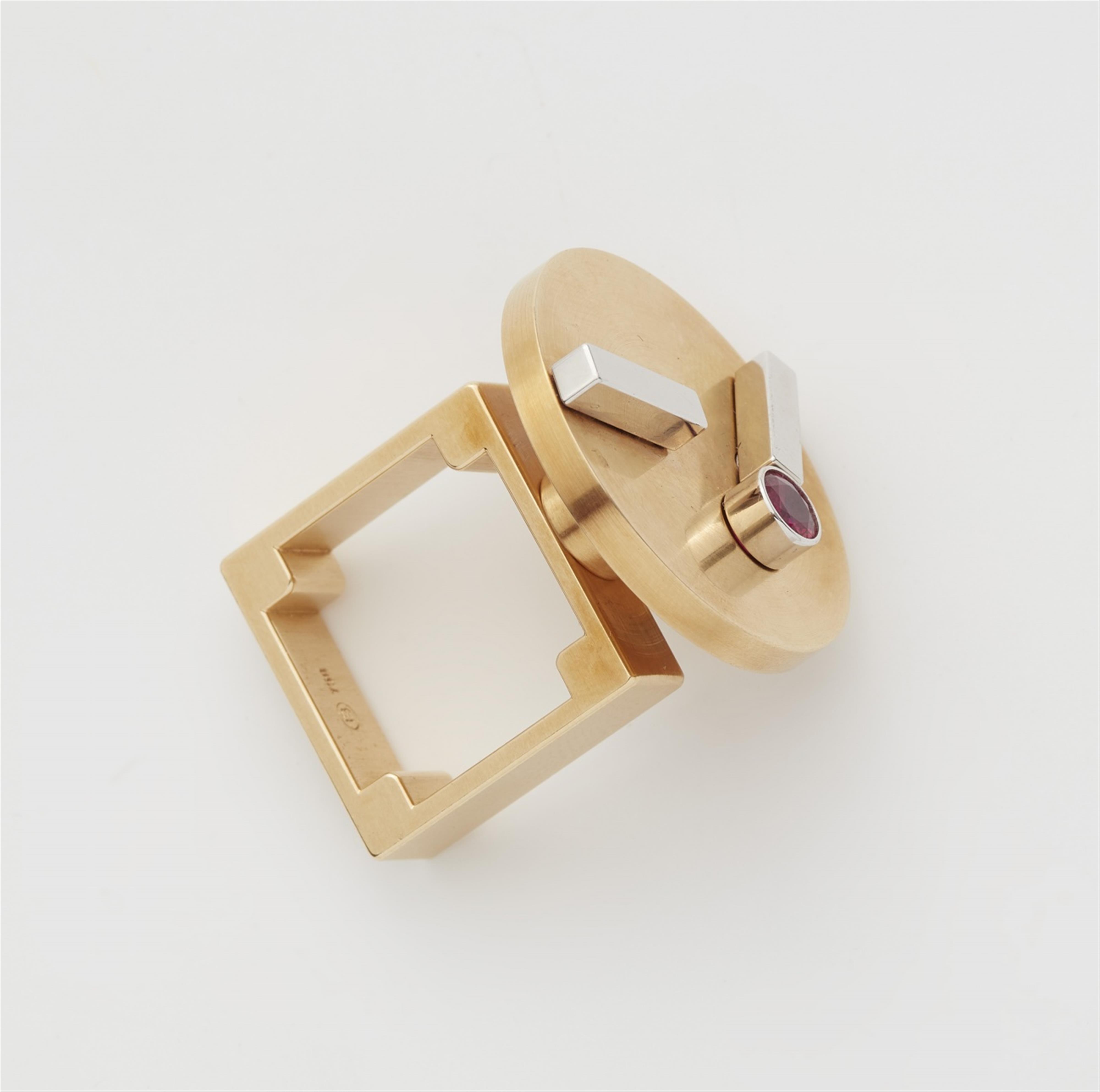 An 18k bi-colour gold and ruby kinetic ring - image-2