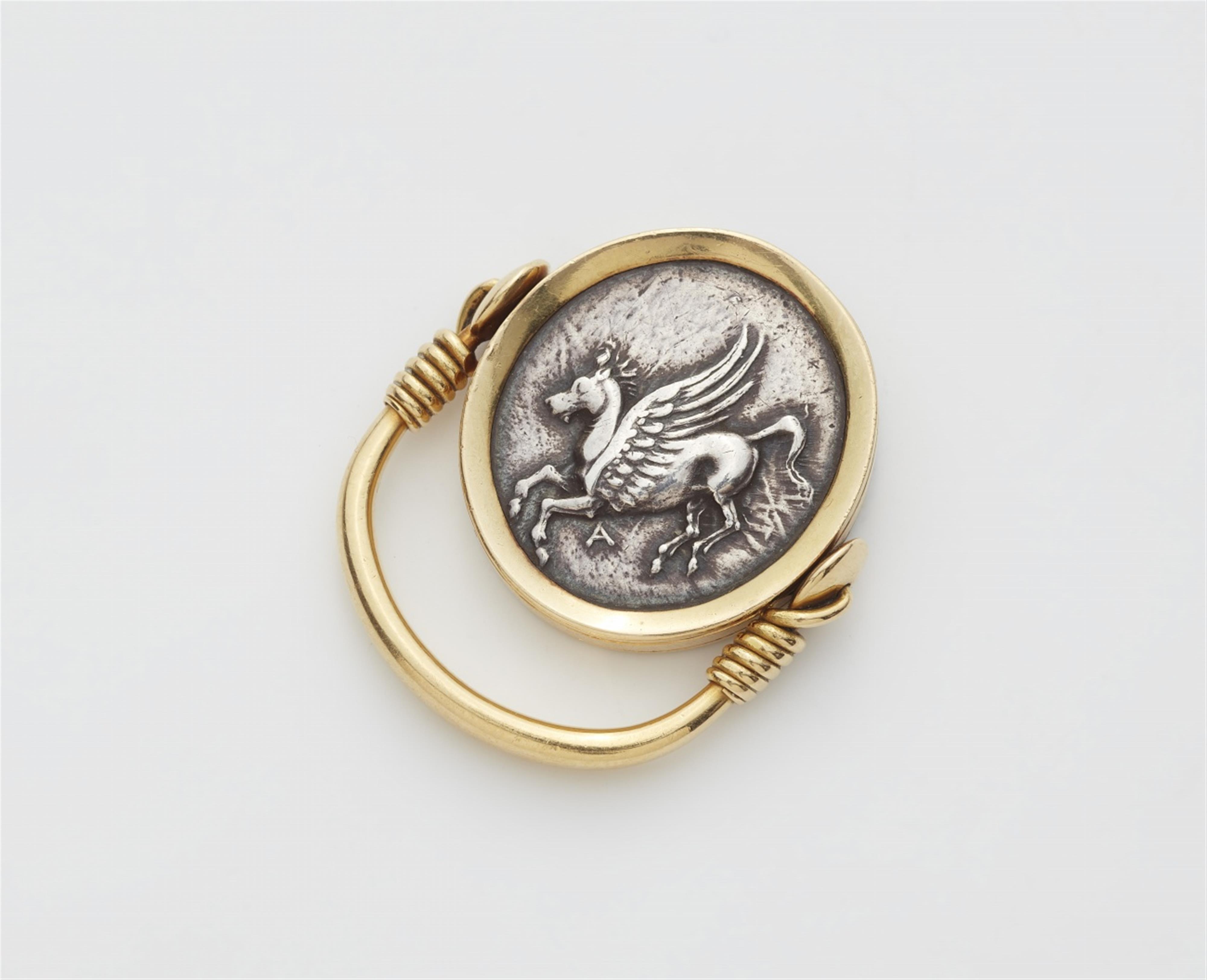An 18k gold twisting ring with a Hellenistic coin - image-2