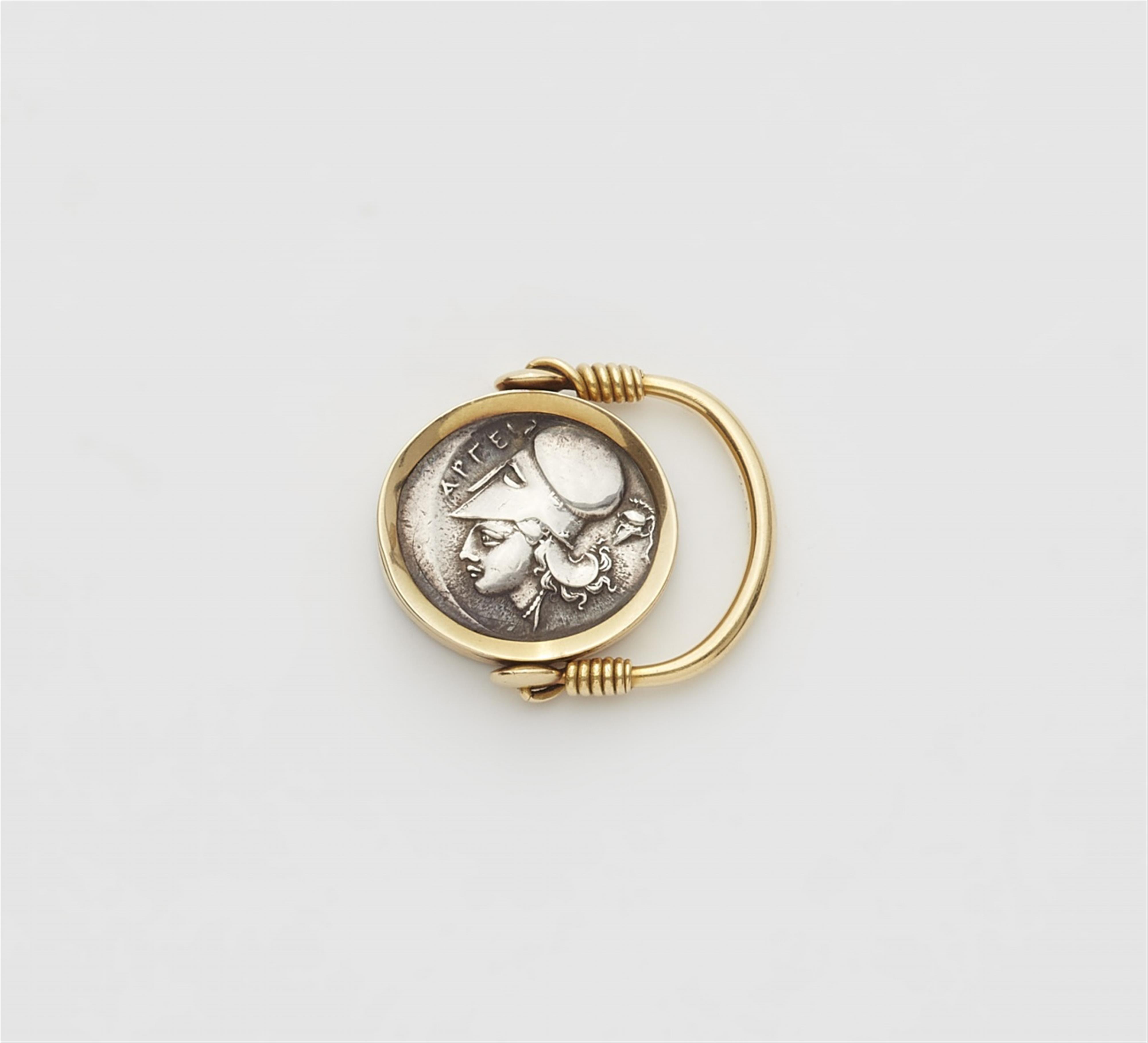 An 18k gold twisting ring with a Hellenistic coin - image-1