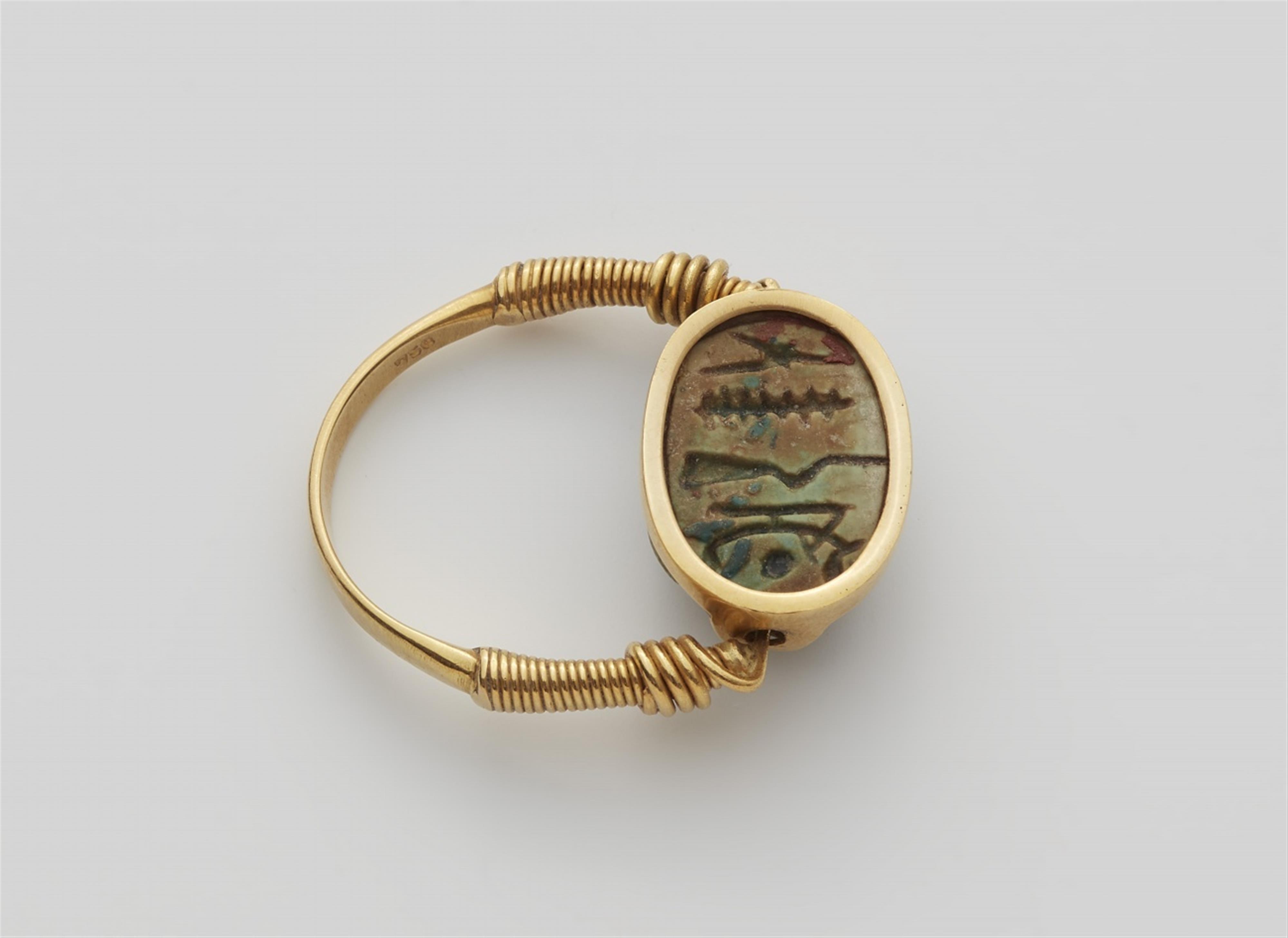 An 18k gold twisting ring with an ancient Egyptian scarab amulet - image-2