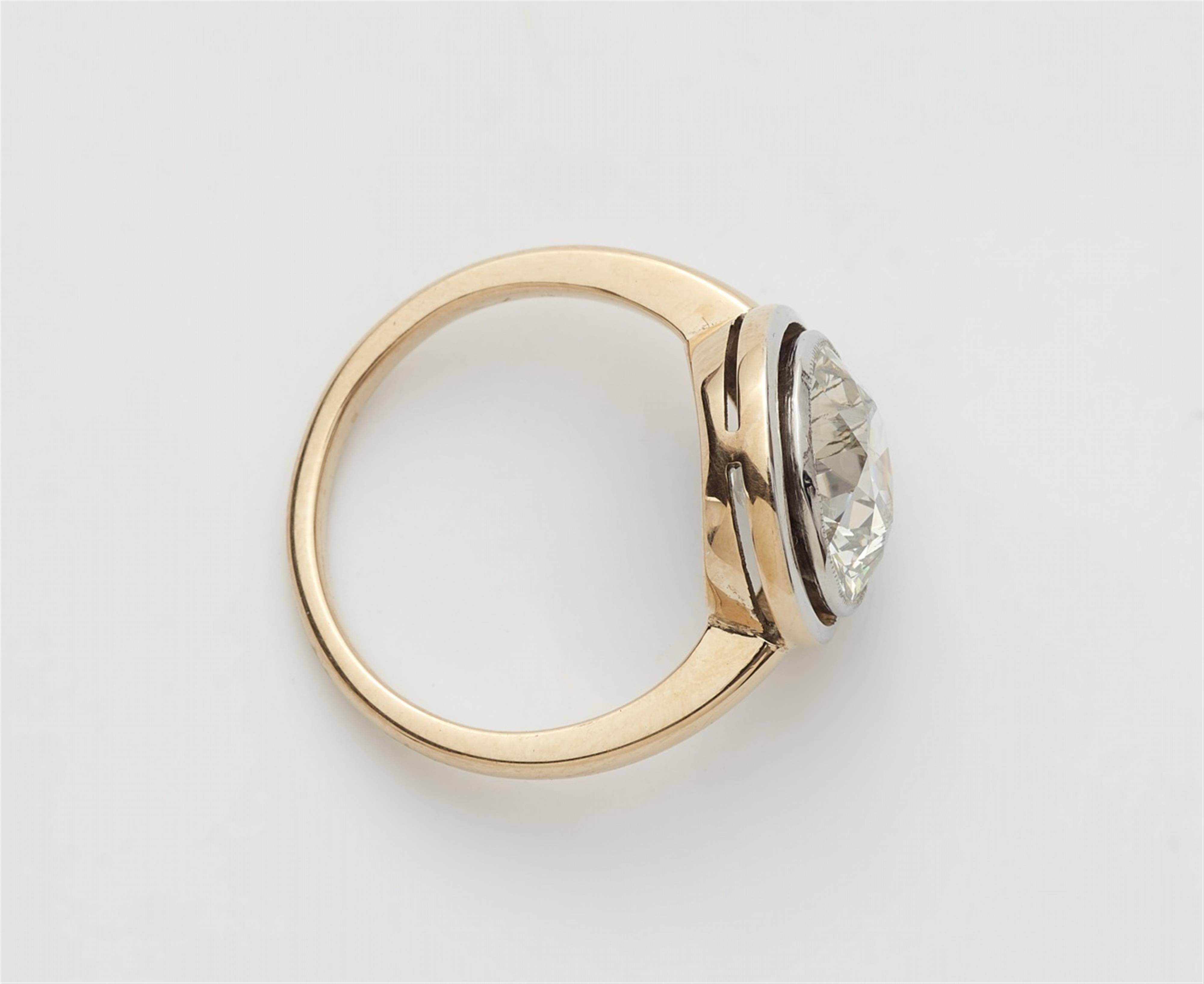 A 14k gold and platinum solitaire ring with a European old-cut diamond - image-3