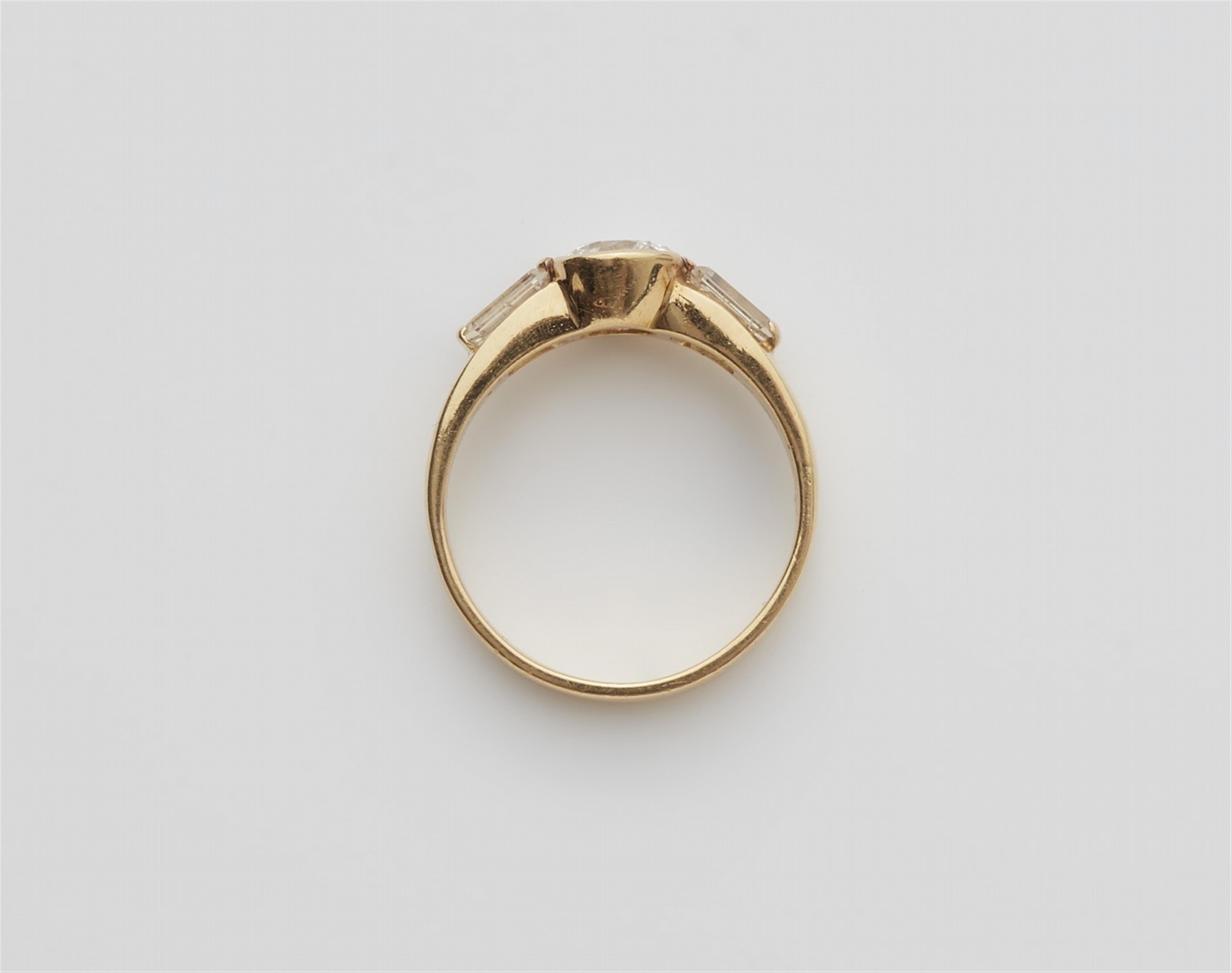 An 18k gold diamond trinity ring - image-3