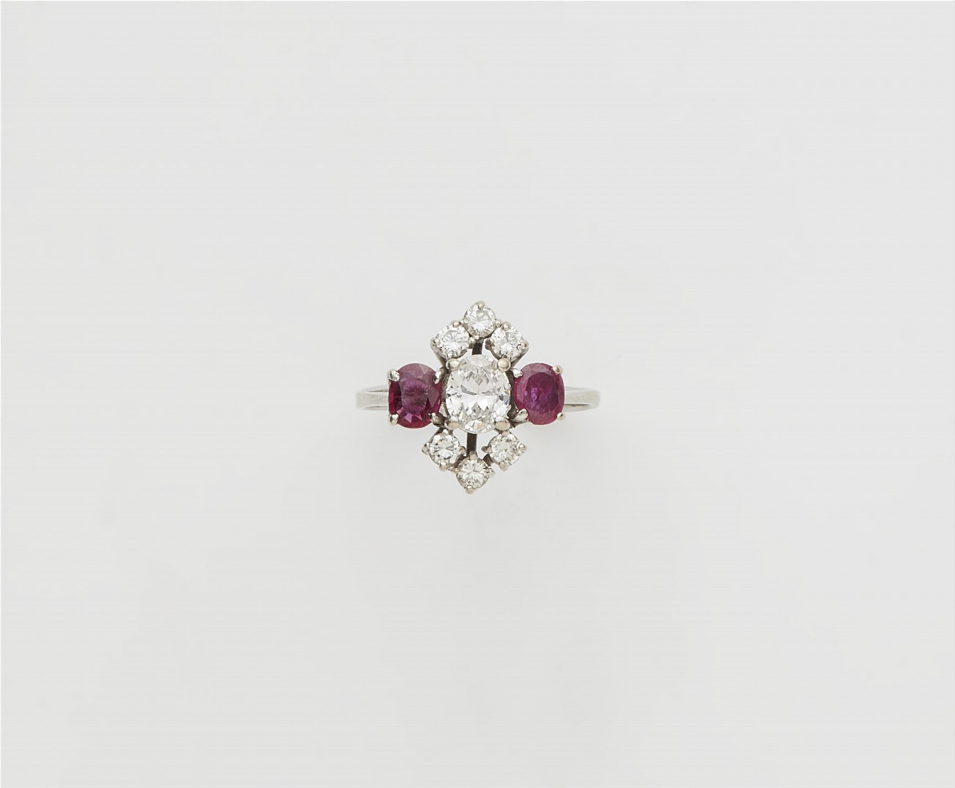 A 14k white gold diamond and ruby ring - image-1