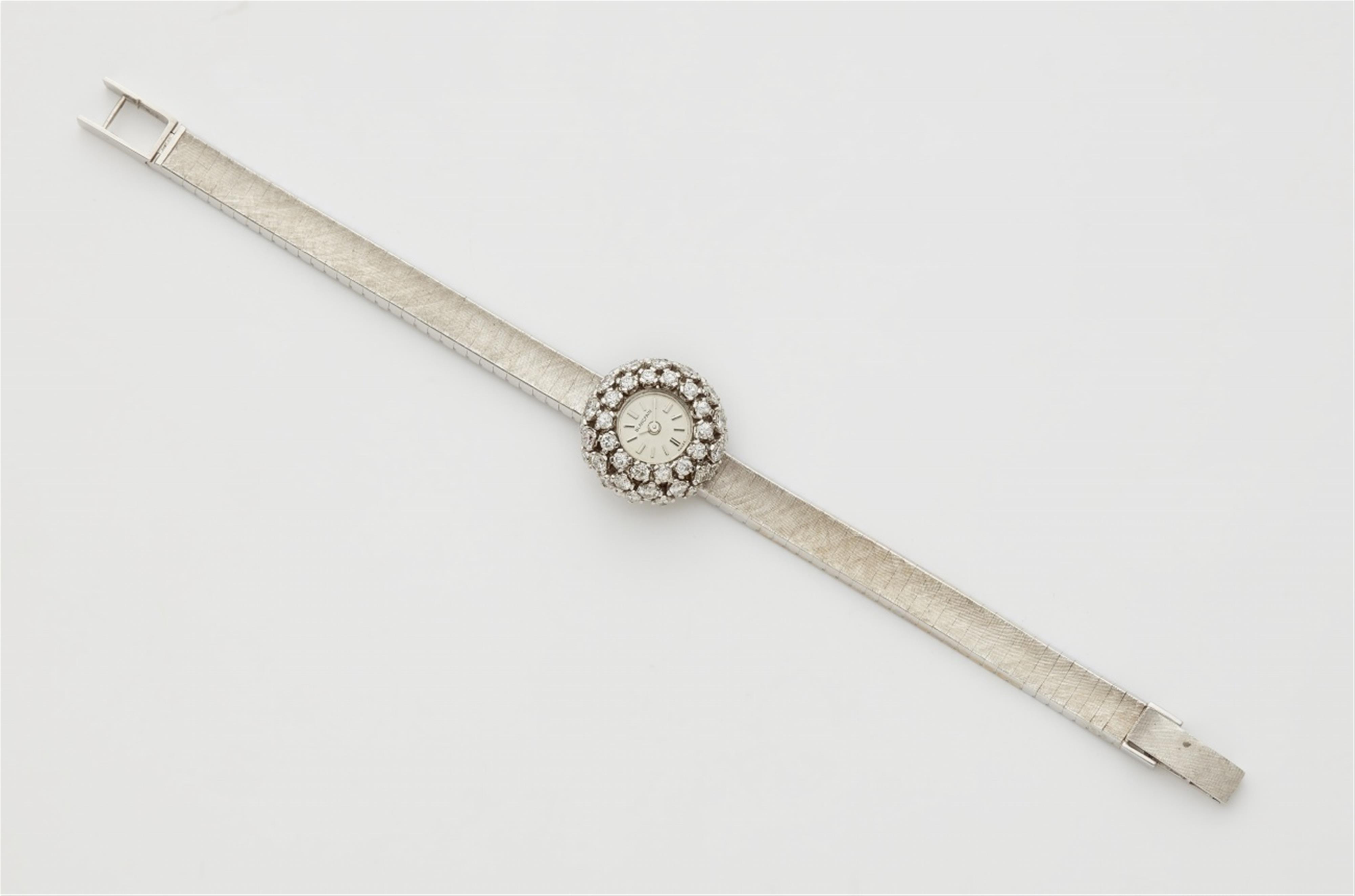 An 18k white gold diamond cocktail wristwatch - image-1
