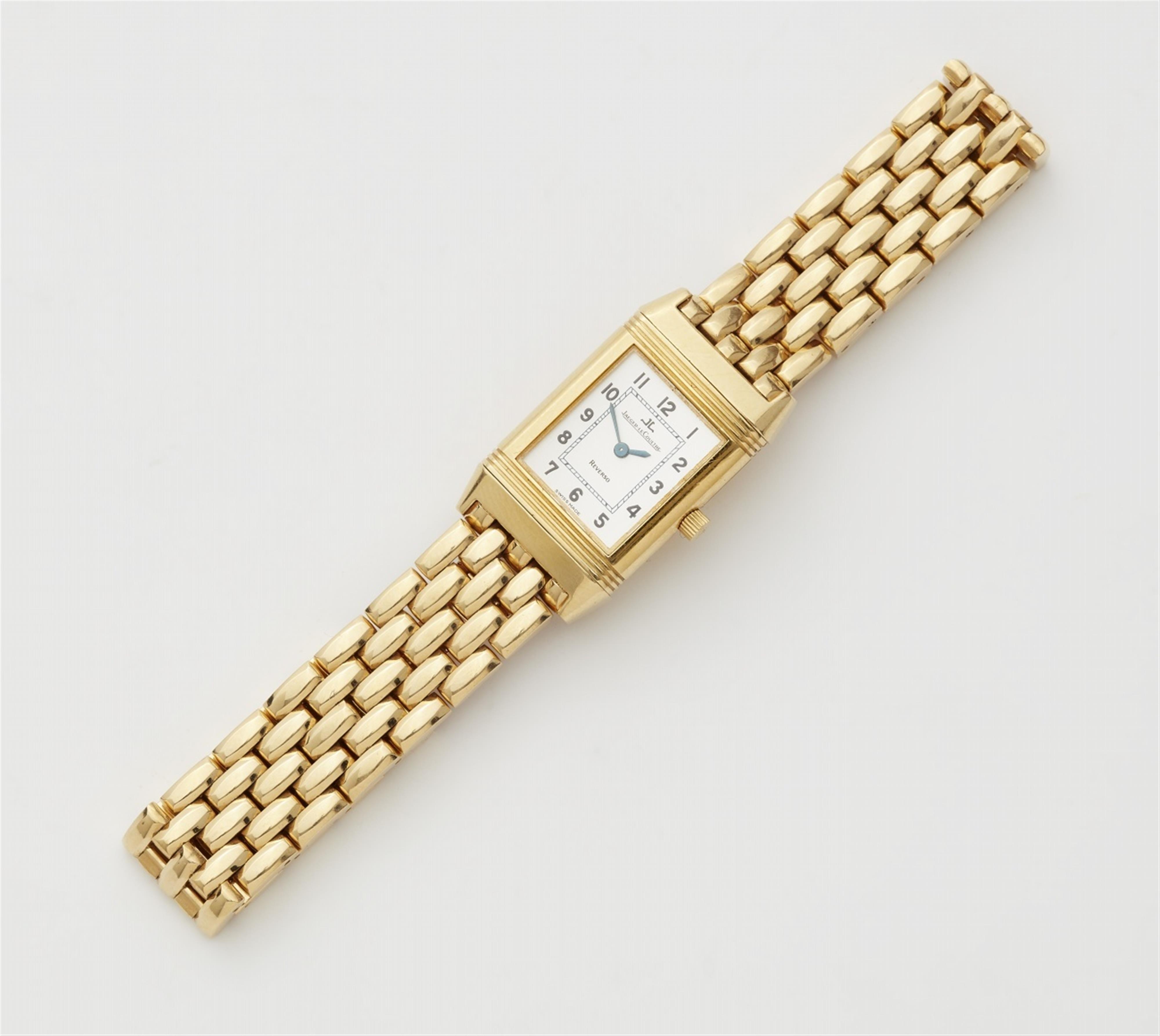 An 18k gold Reverso Lady Quartz wrist watch with box and papers - image-1
