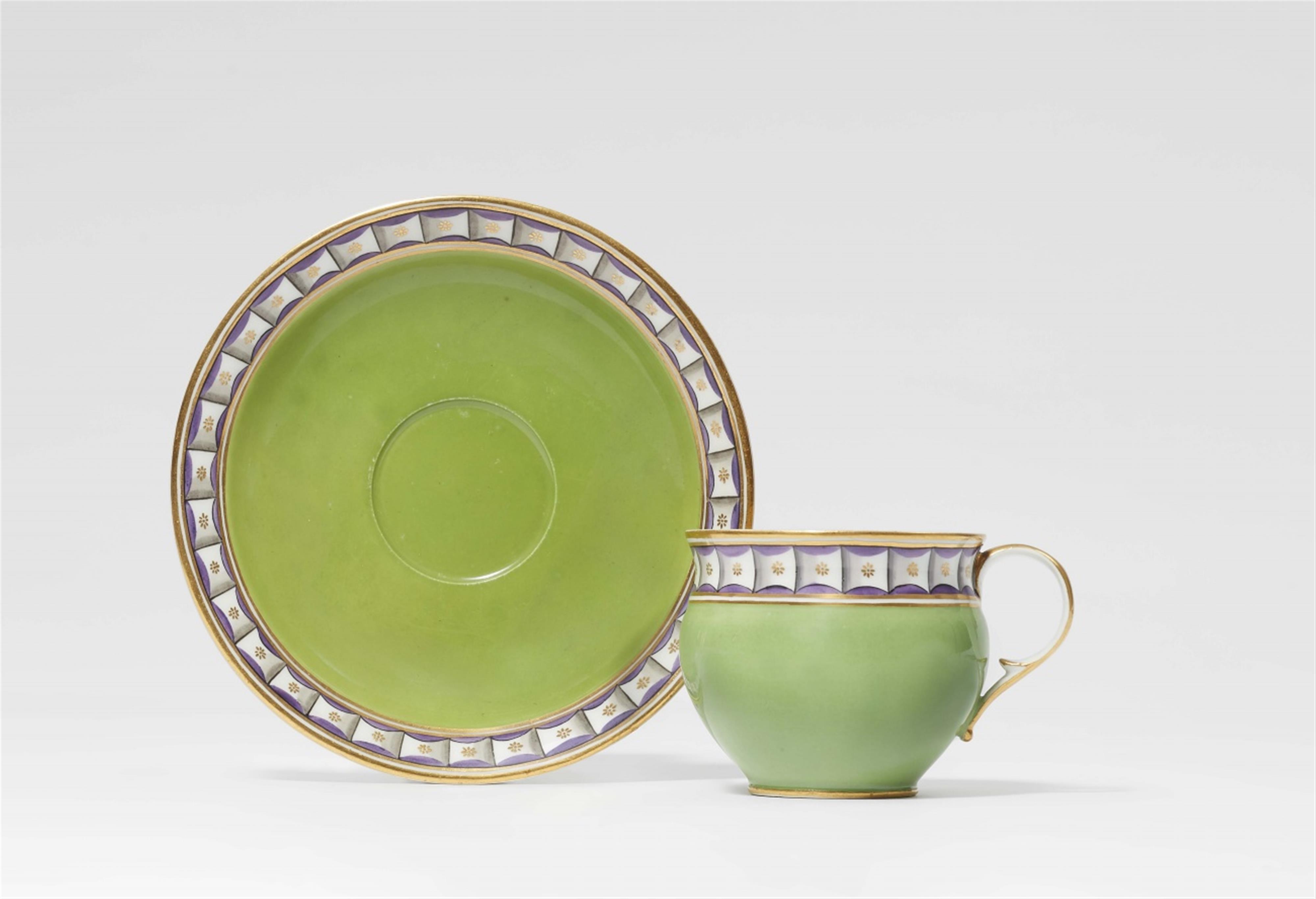A Meissen porcelain cup and saucer with apple green ground - image-1