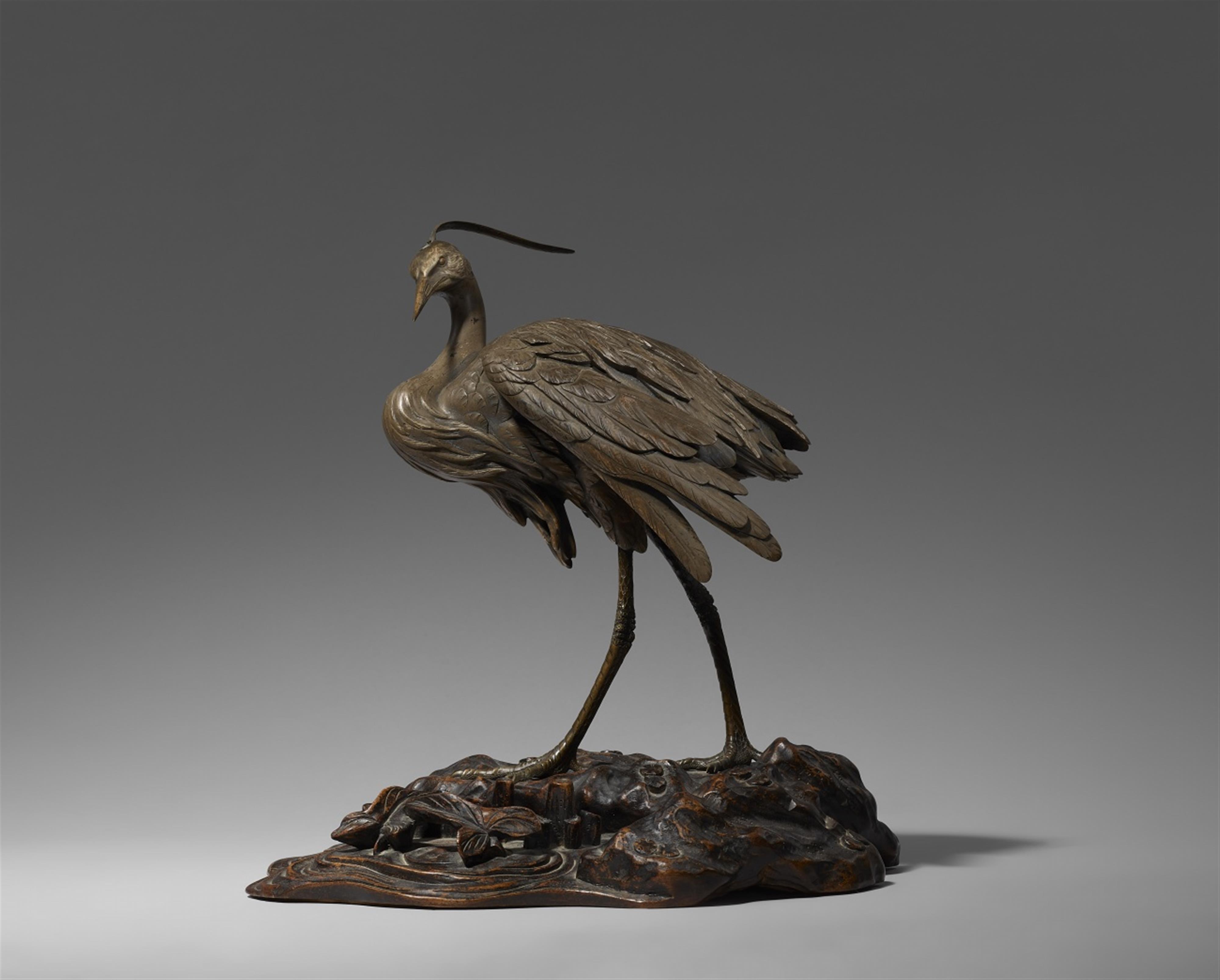 A partly silvered bronze figure of a heron. Late 19th century - image-1