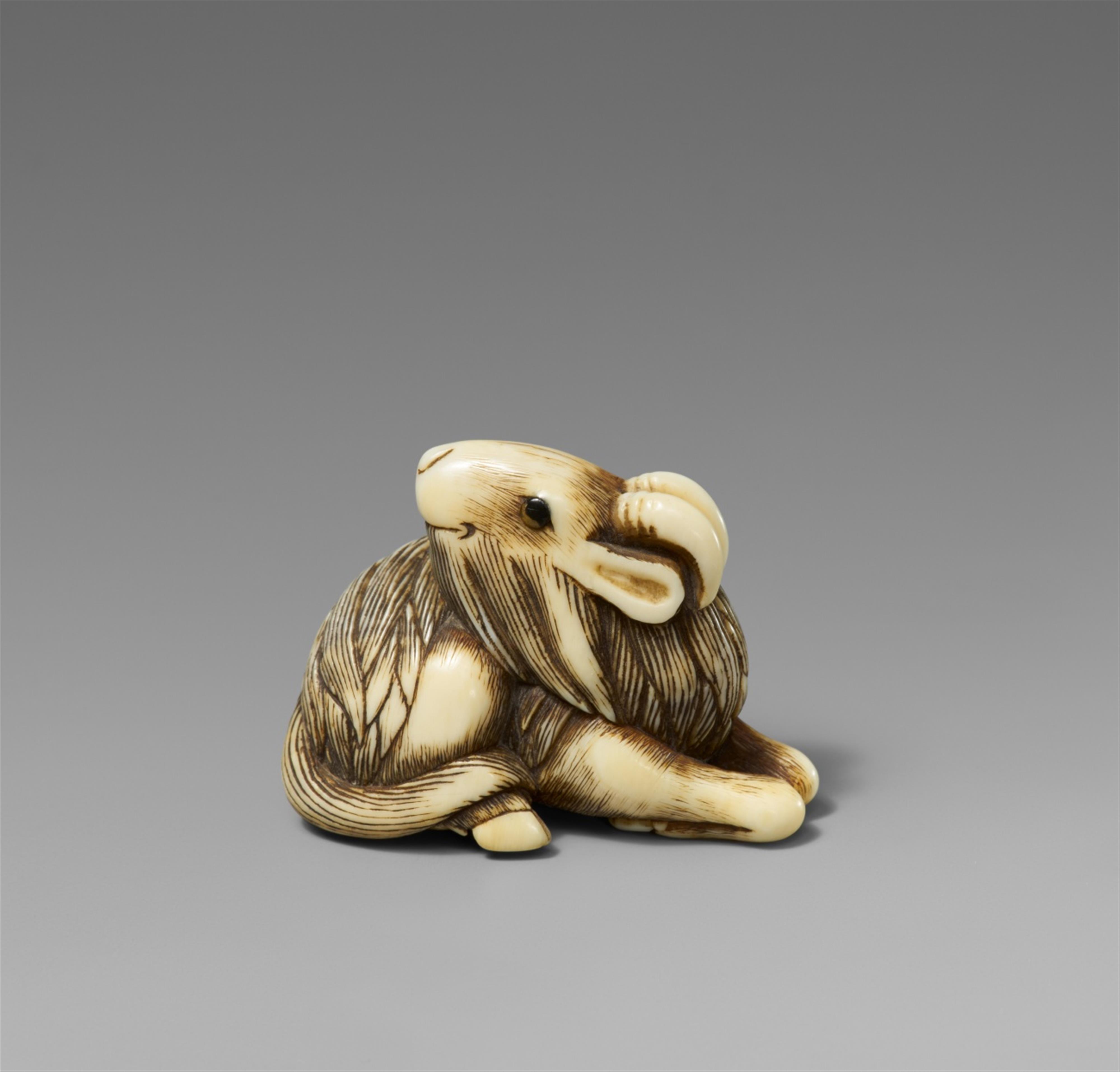 An ivory netsuke of a long-haired goat. Early 19th century - image-1