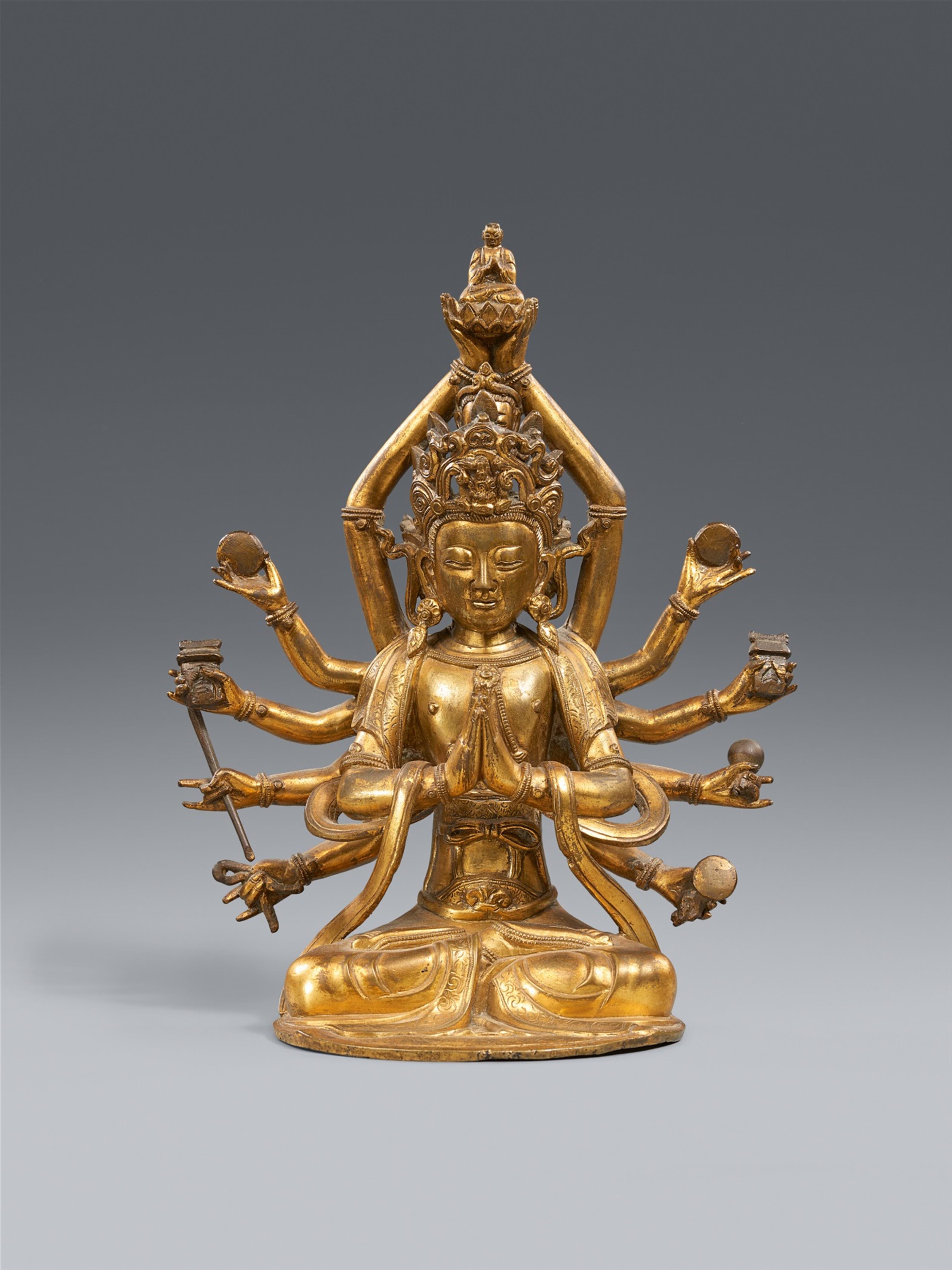 A fire-gilt bronze figure of a twelve-armed and four-headed Guanyin. 17th/18th century - image-1