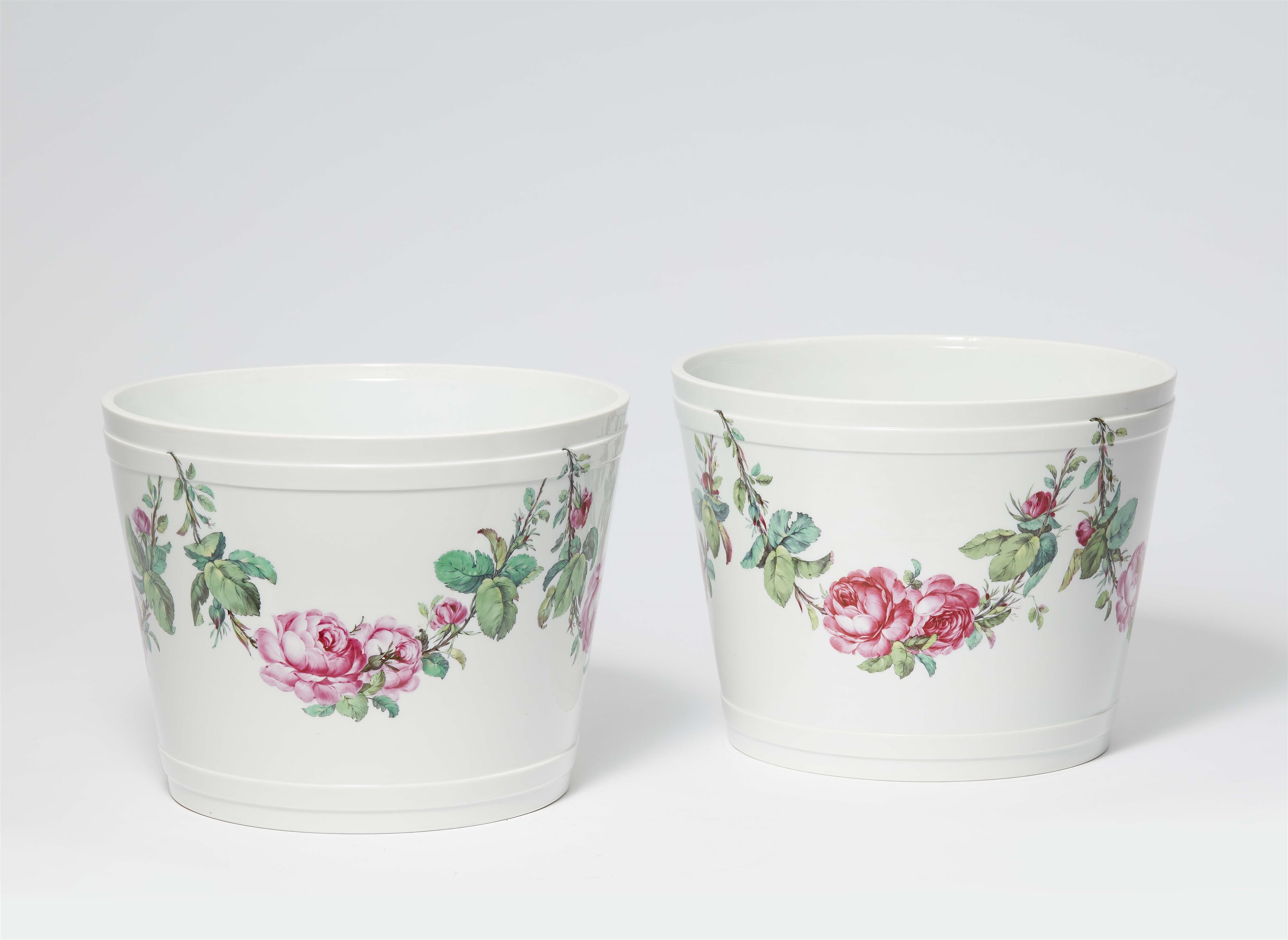 A pair of Berlin KPM porcelain cachepots with rose garlands - image-1