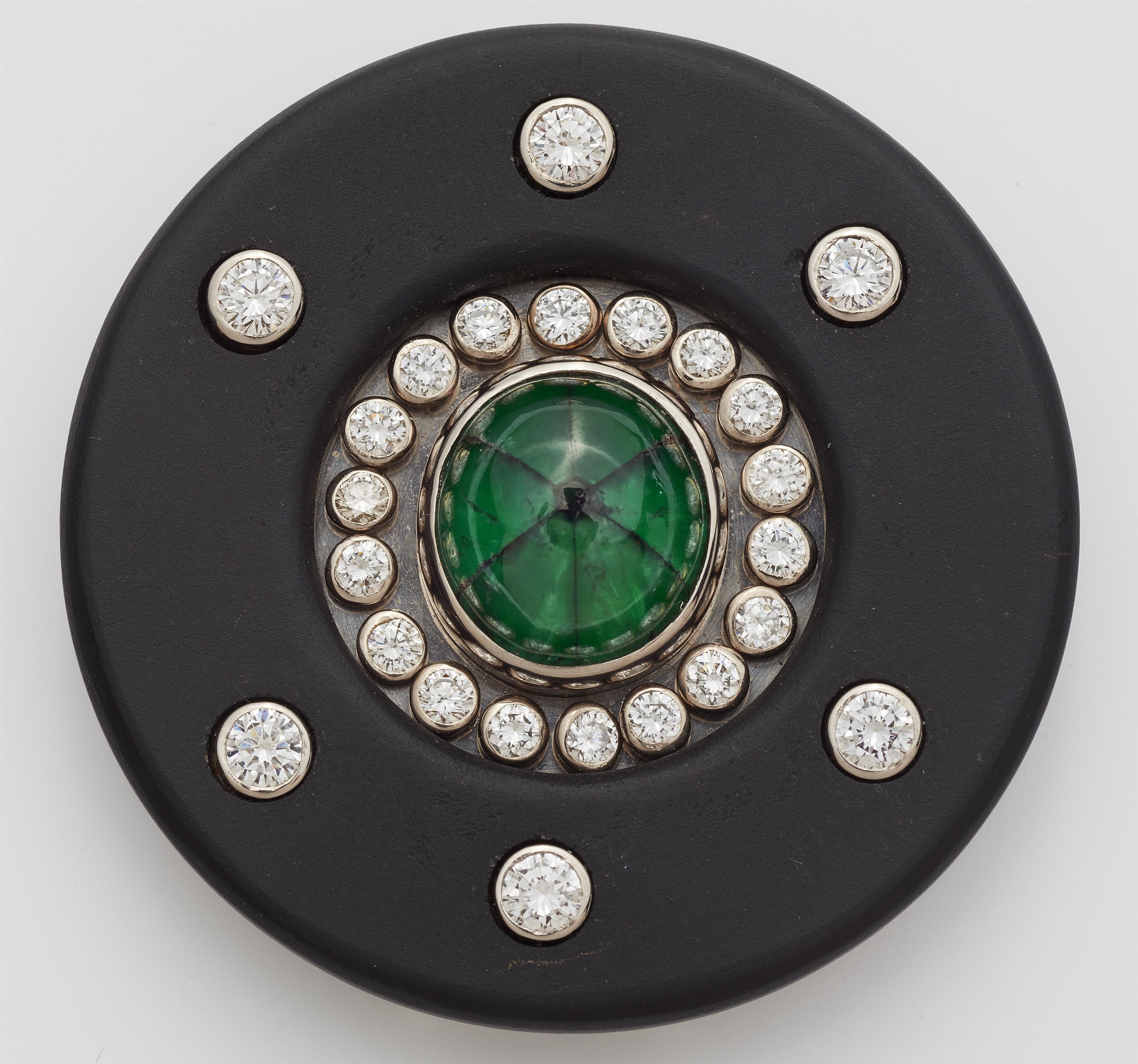 A German 18k white gold onyx and diamond brooch with a rare natural Colombian Trapiche emerald. - image-1