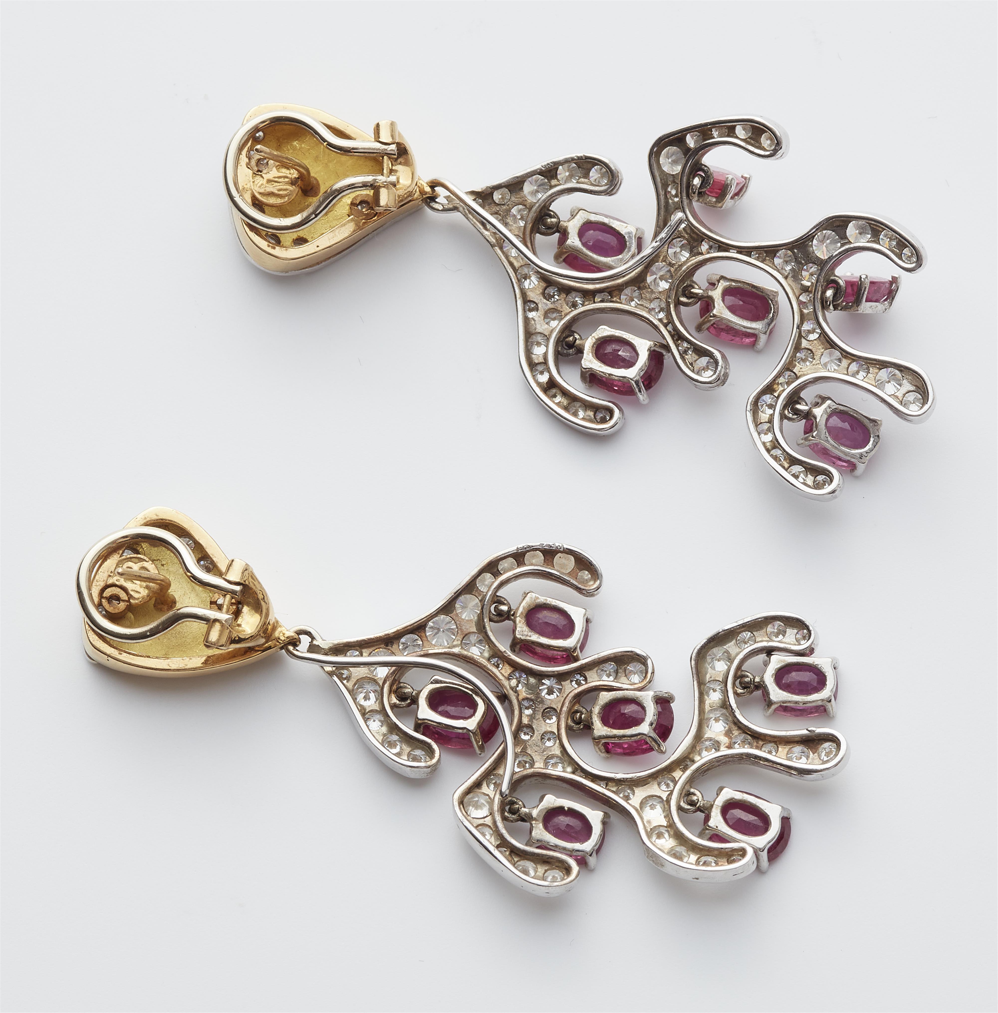 A pair of Austrian 18k gold diamond and pink ruby pendant earrings. - image-2