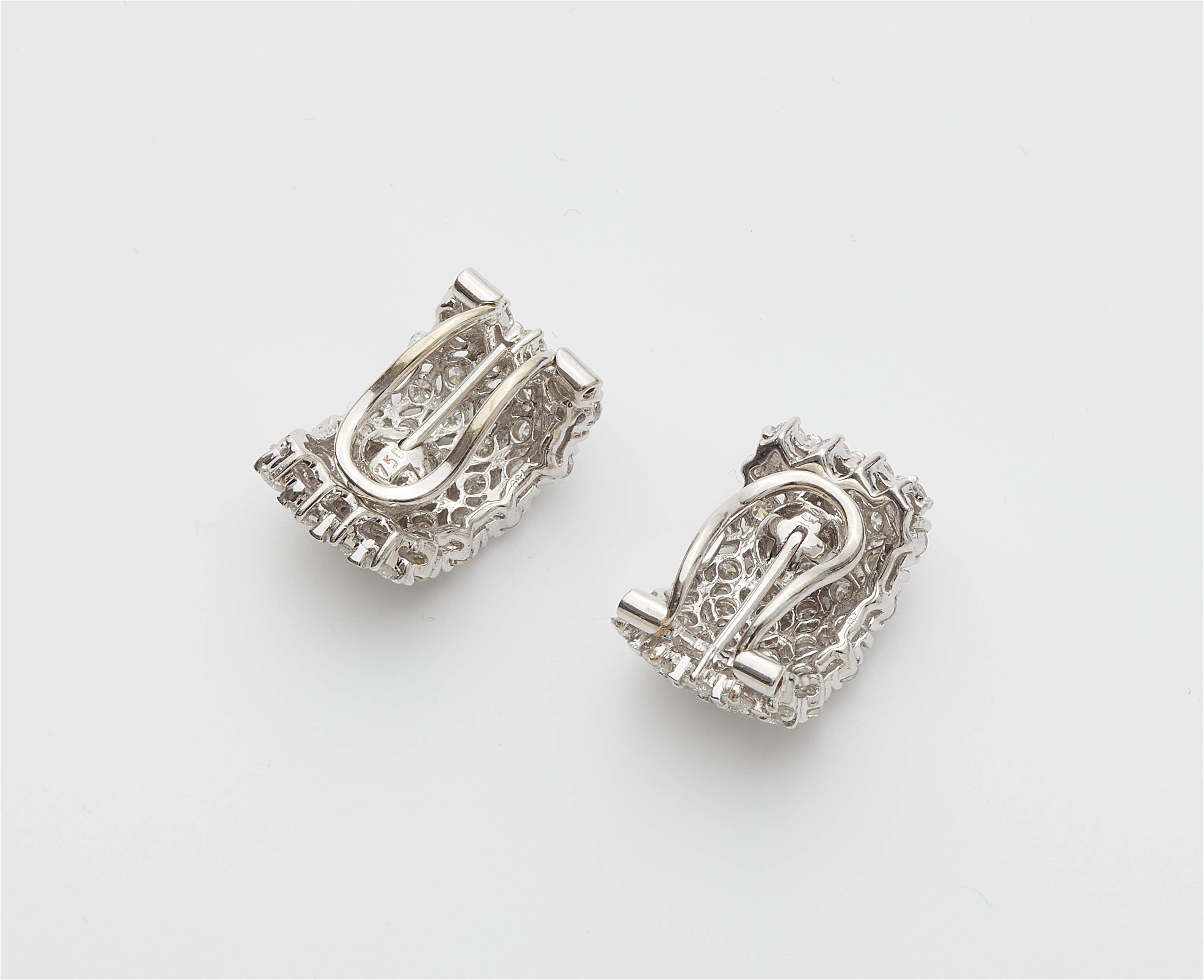 A pair of 18k white gold and diamond ear clips. - image-2