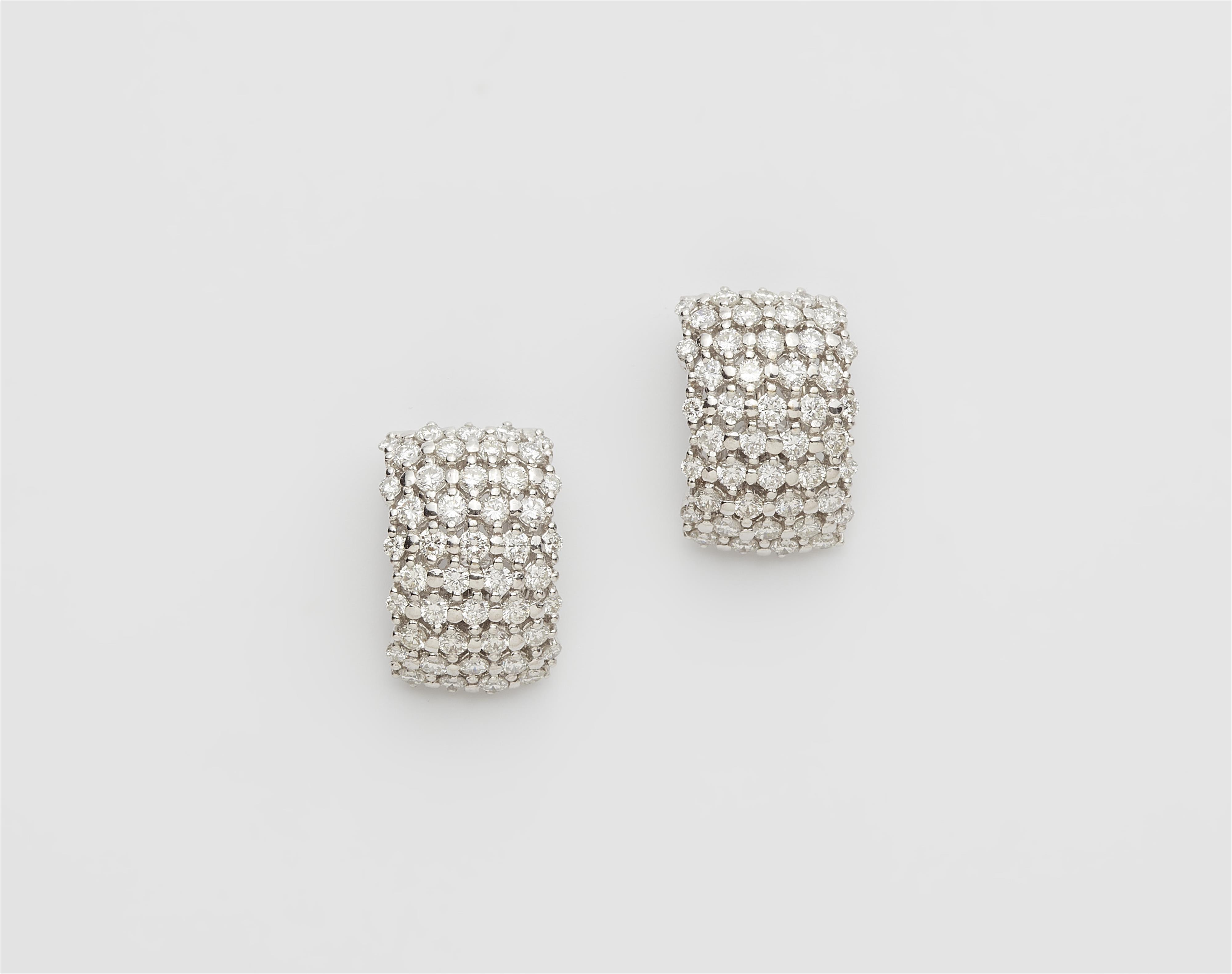 A pair of 18k white gold and diamond ear clips. - image-1