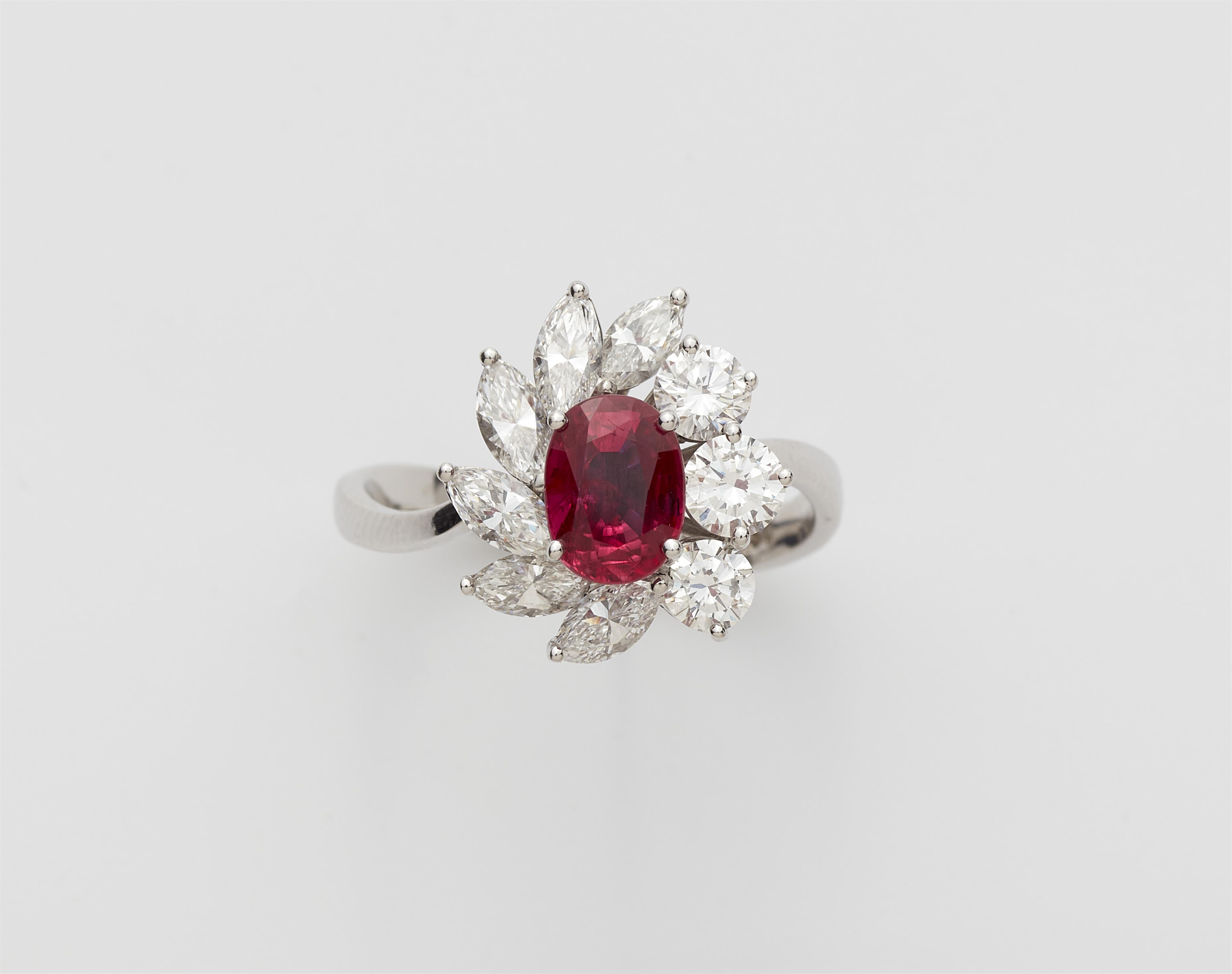 An 18k white gold diamond and ruby cluster ring. - image-1