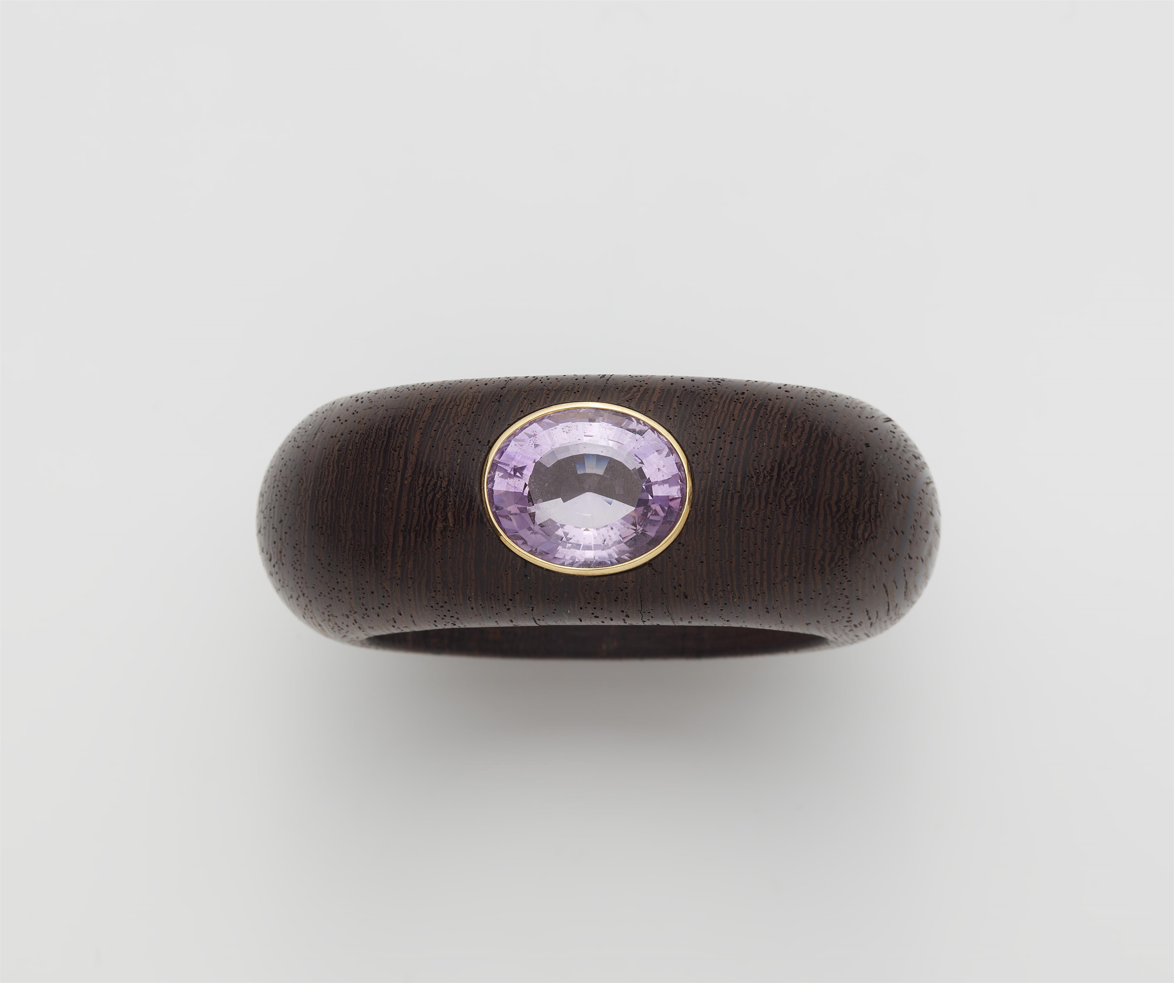 A wood bangle with a 14k gold mounted pink amethyst. - image-1