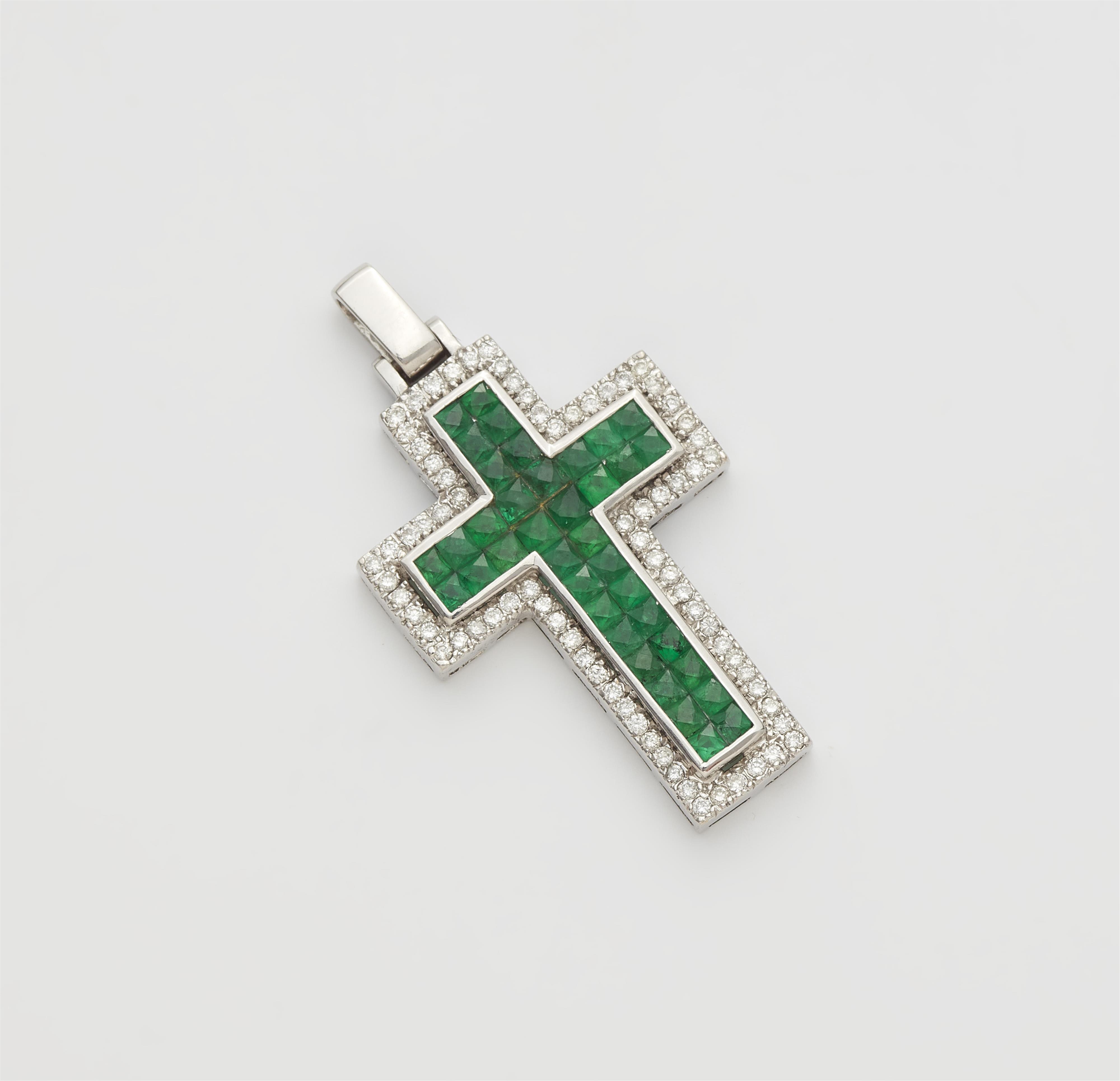 An 18k gold diamond and emerald cross pendant. - image-1