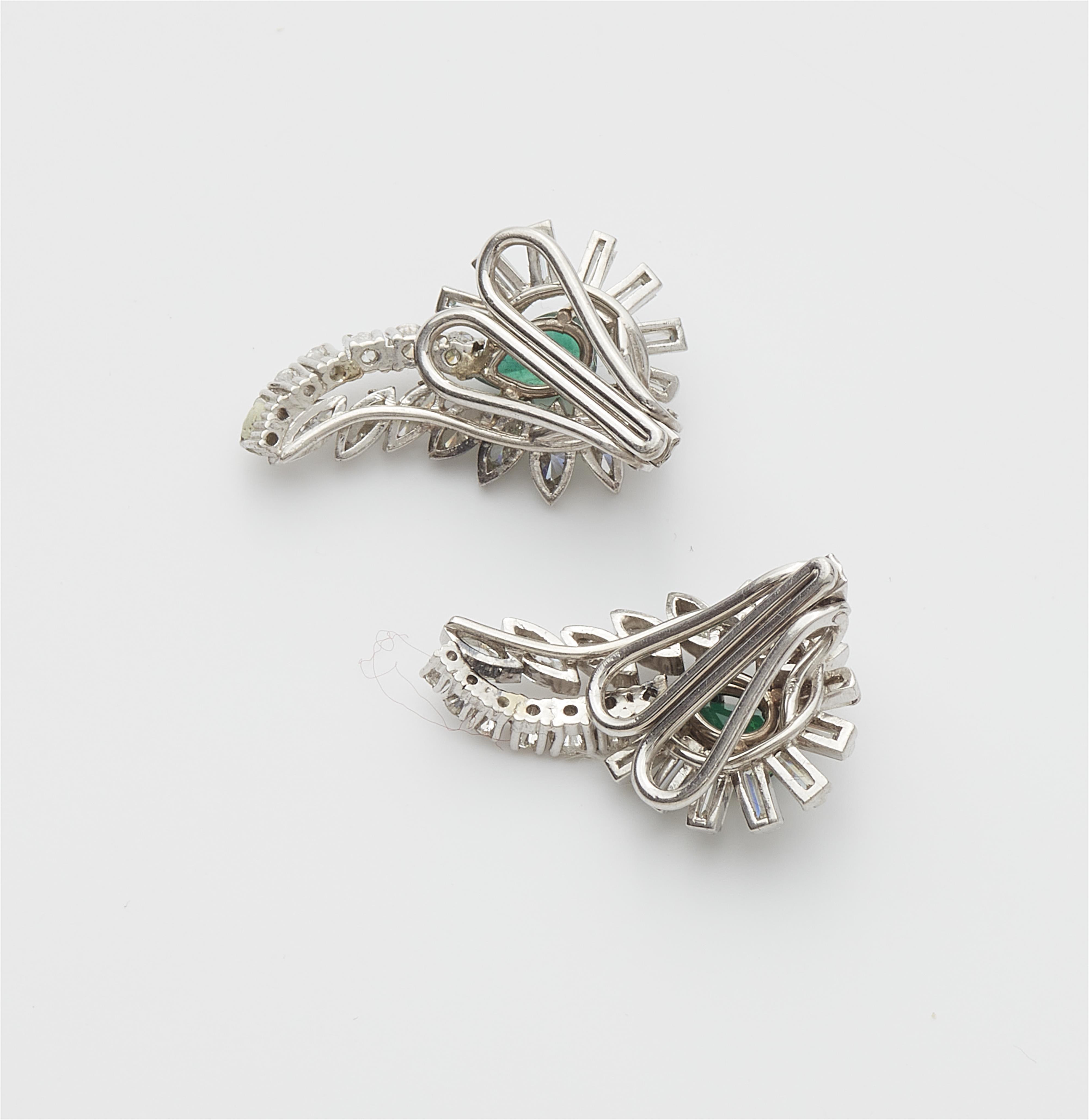 A pair of 18k white gold diamond and emerald ear clips. - image-2