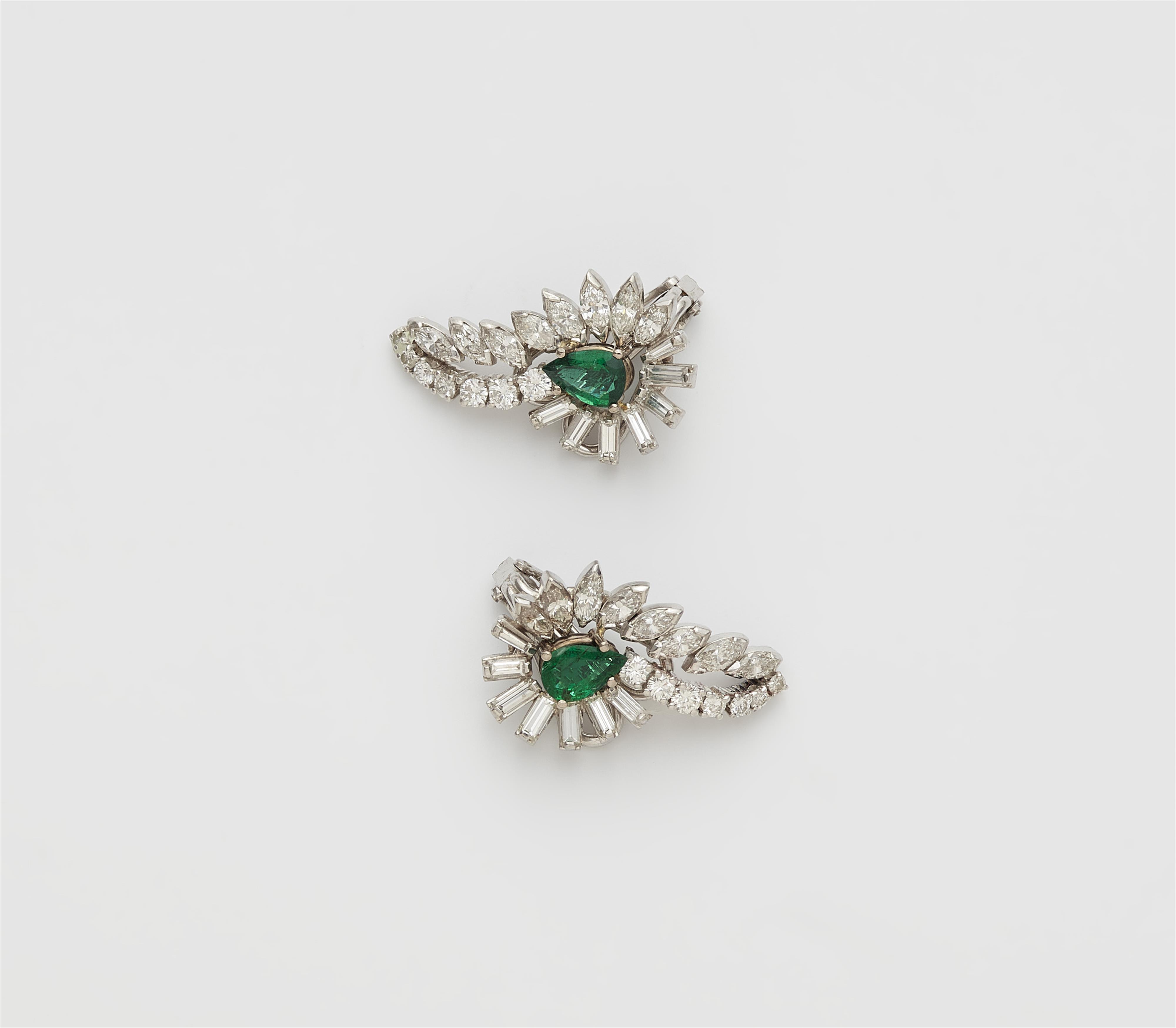 A pair of 18k white gold diamond and emerald ear clips. - image-1
