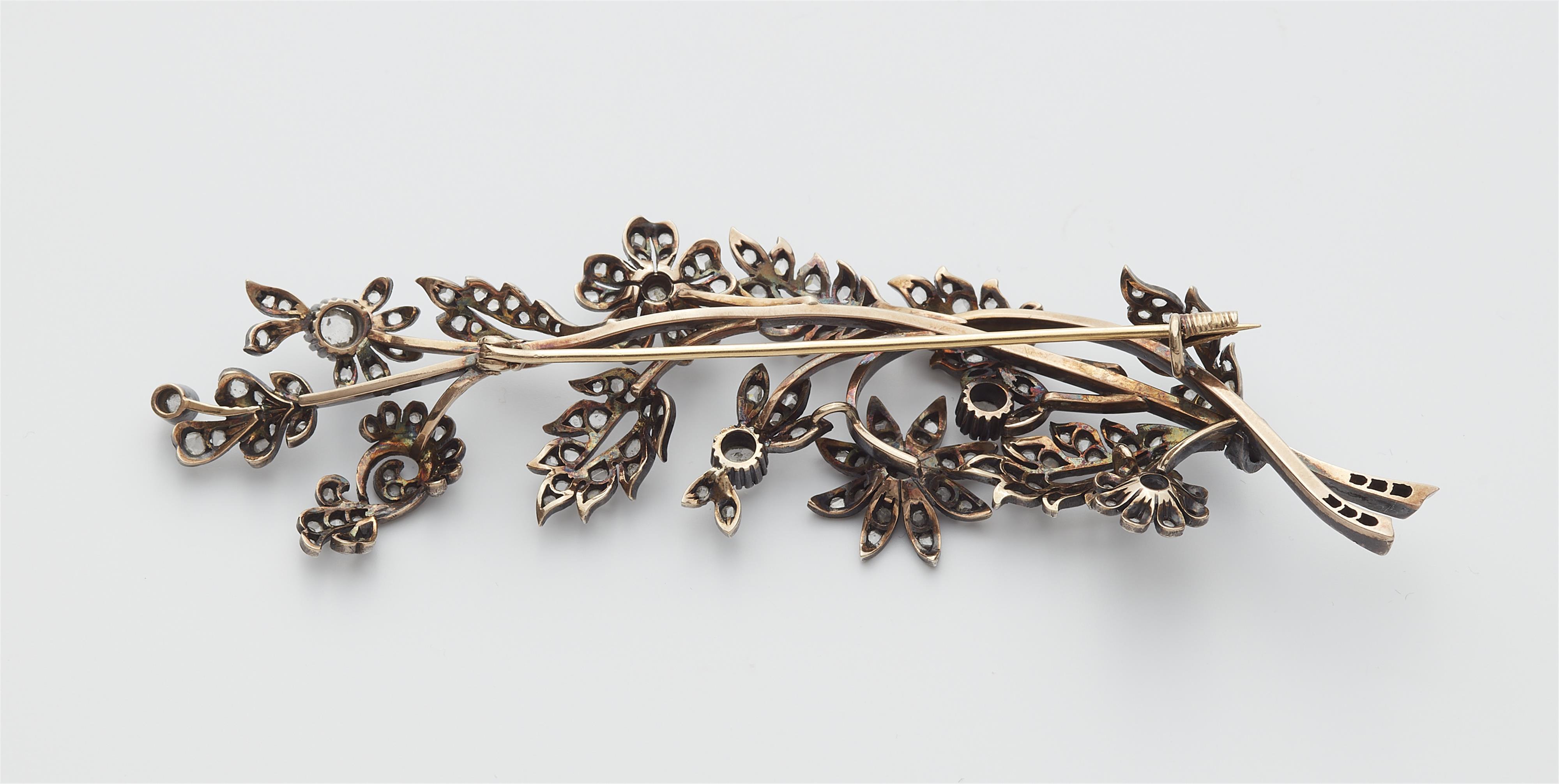 A late 19th century silver, 18k gold and diamond flower sprig brooch. - image-2