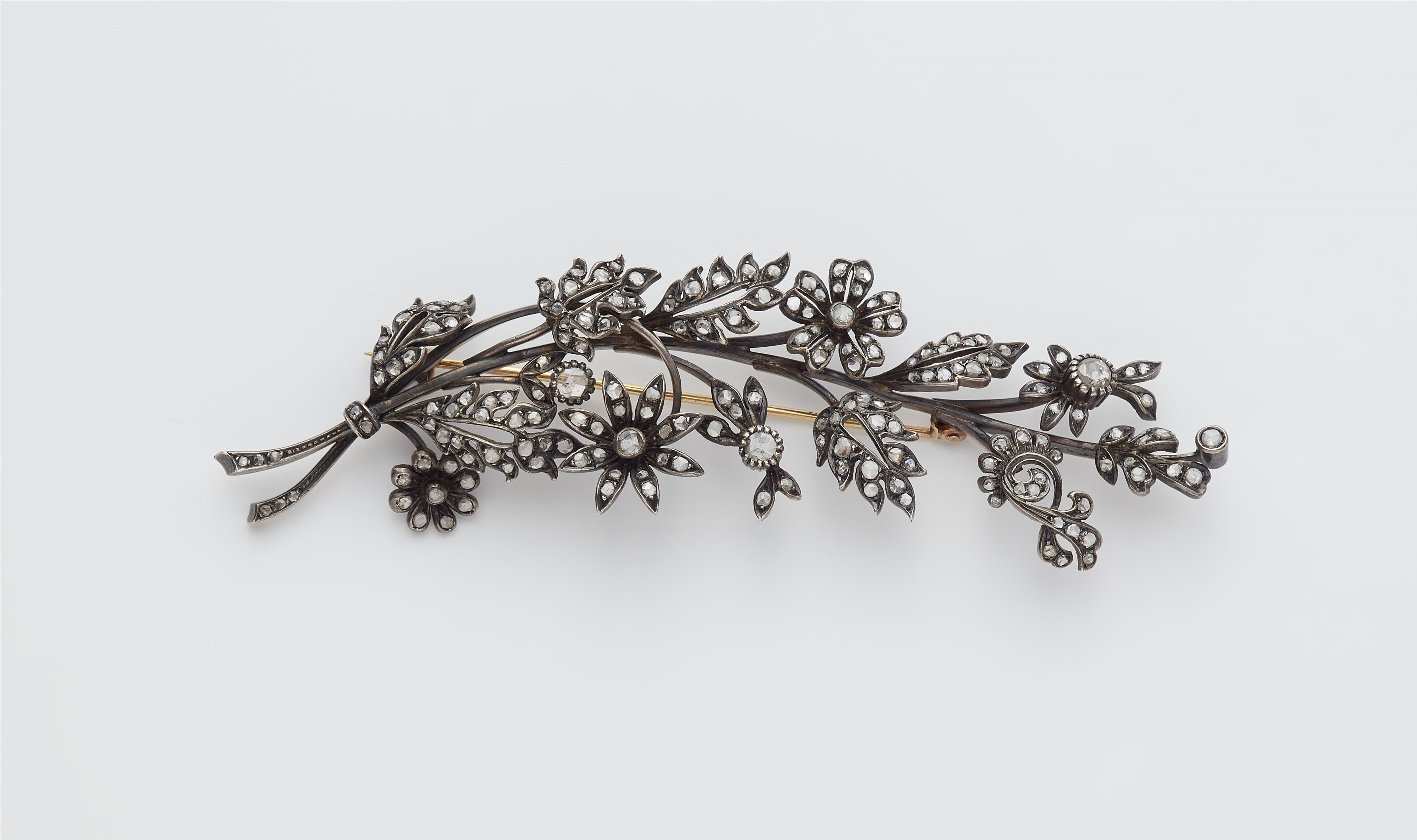 A late 19th century silver, 18k gold and diamond flower sprig brooch. - image-1