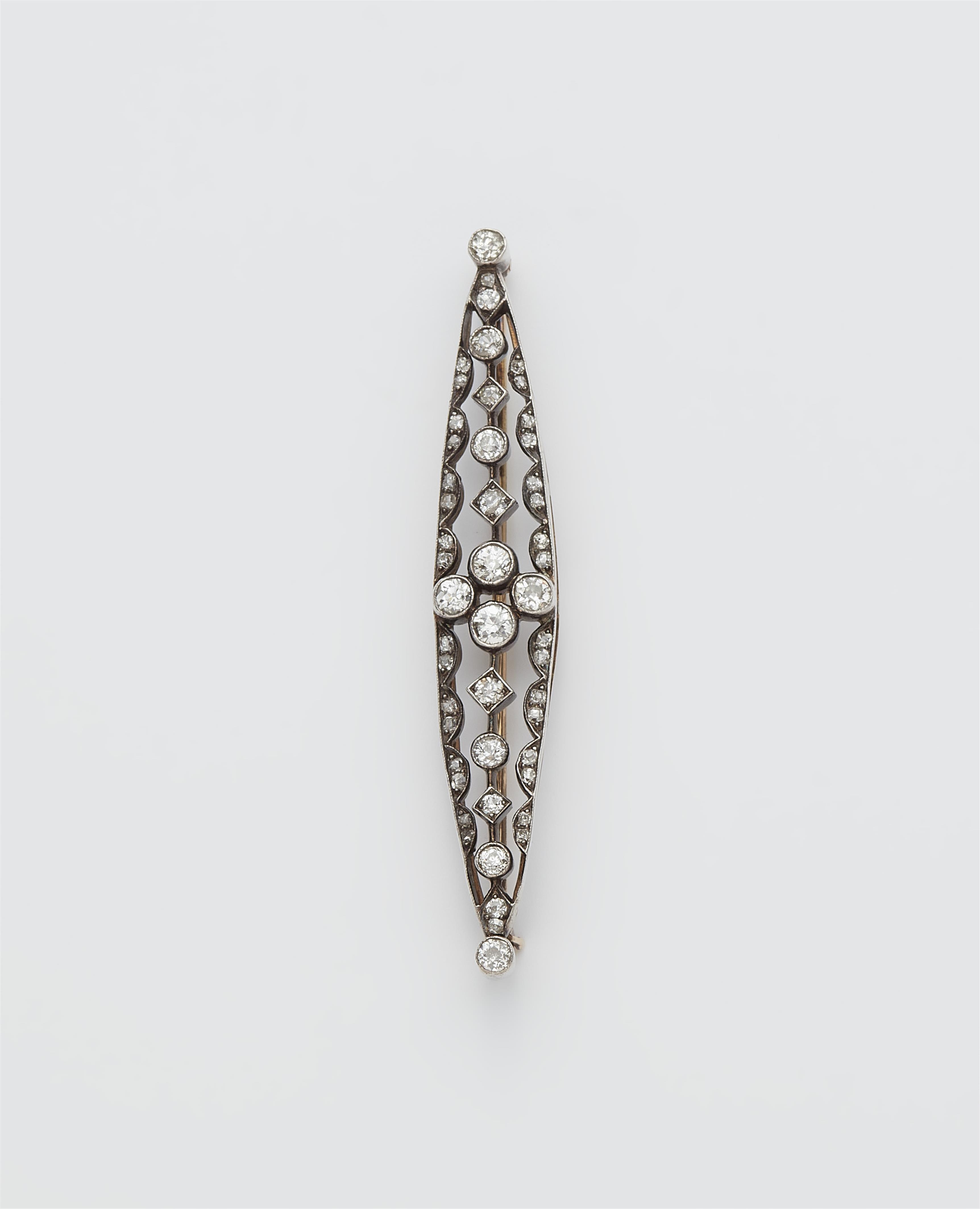 An Austrian late 19th century 14k red gold, silver and diamond bar brooch. - image-1