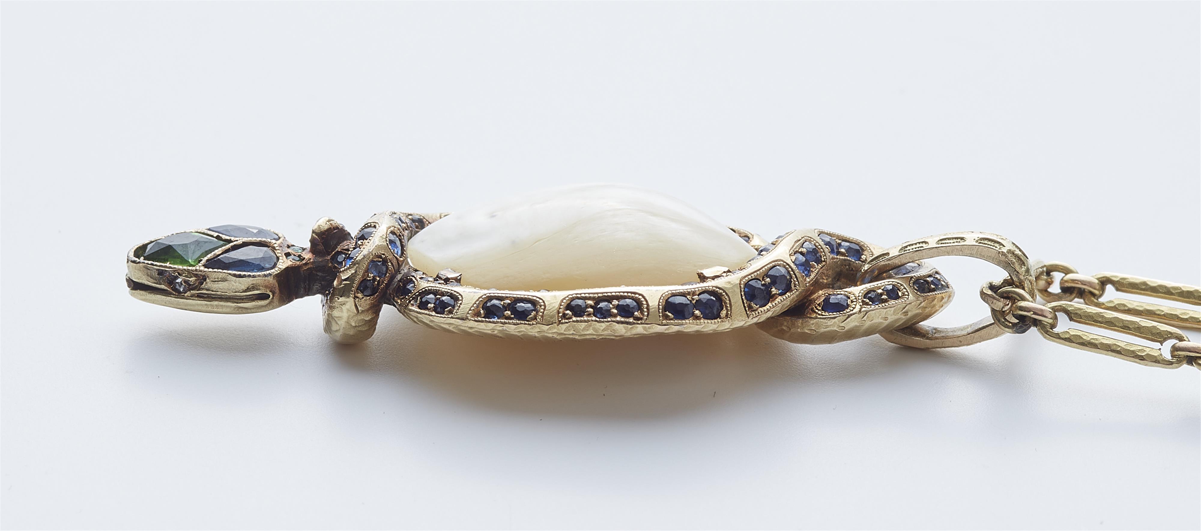 A German 18k gold sapphire, tsavorite and diamond Art Nouveau snake pendant with a large baroque Oriental pearl. - image-4