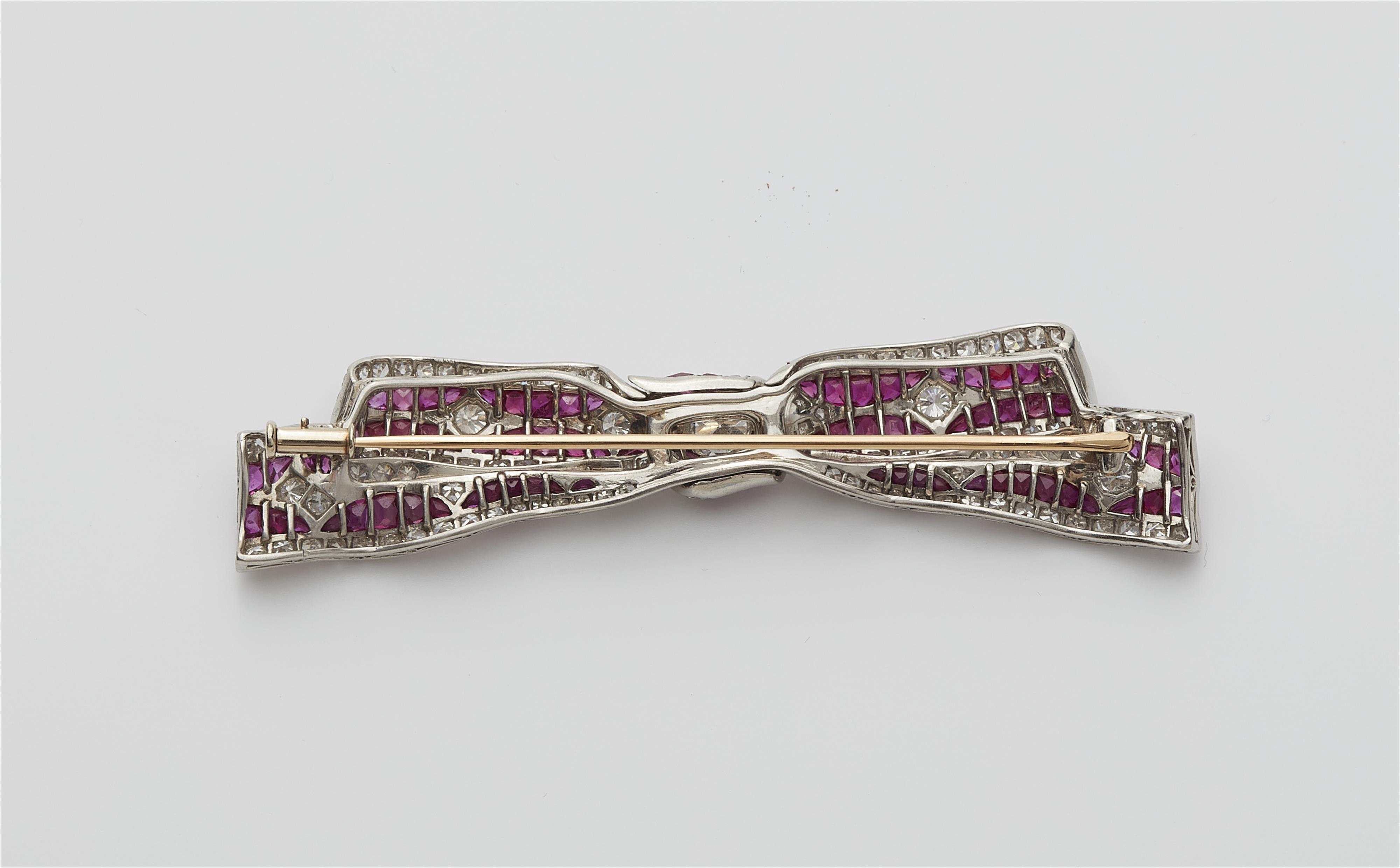 A 14k white gold diamond and ruby Art Deco brooch. - image-2