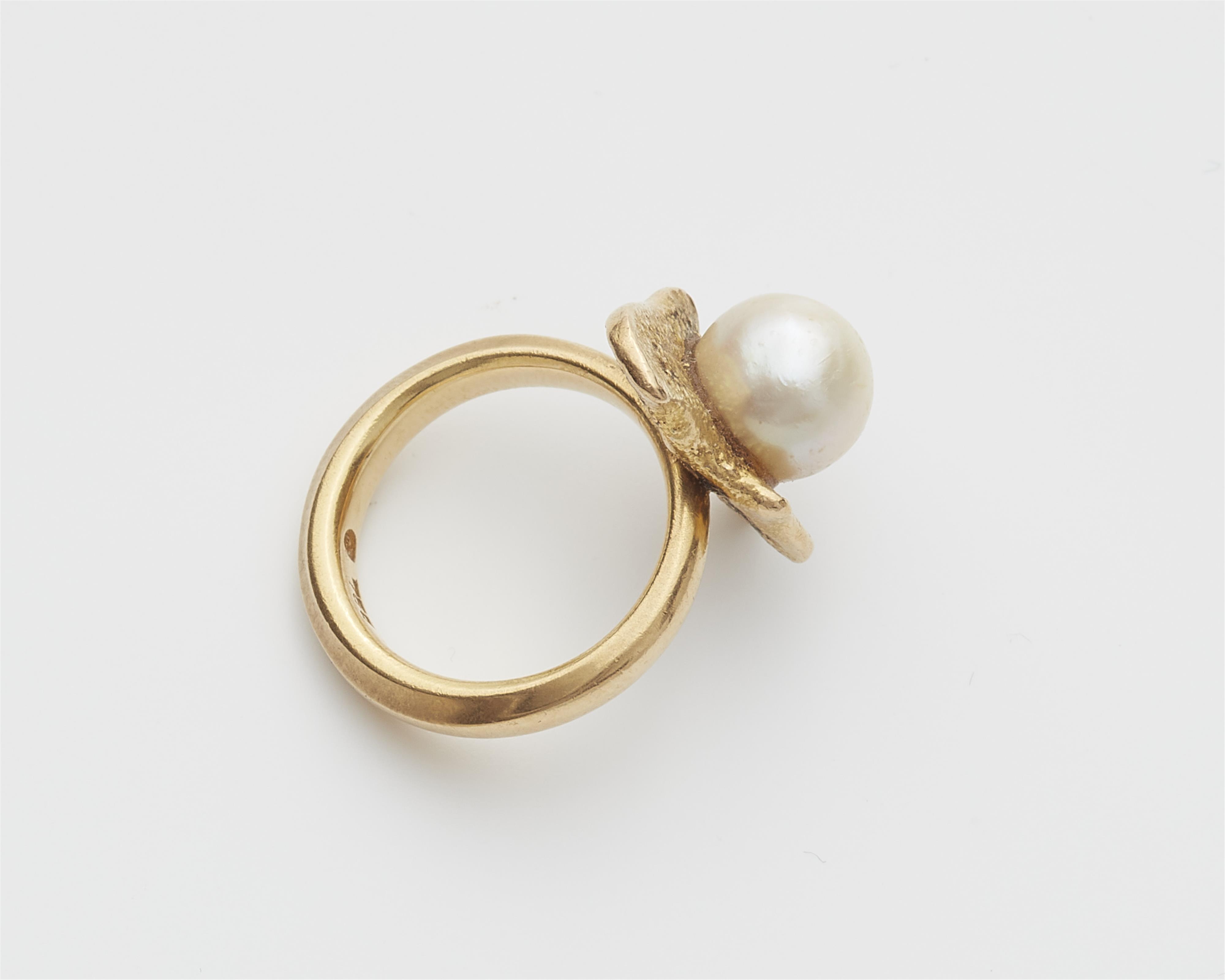 An 18k gold and cultured pearl ring. - image-2