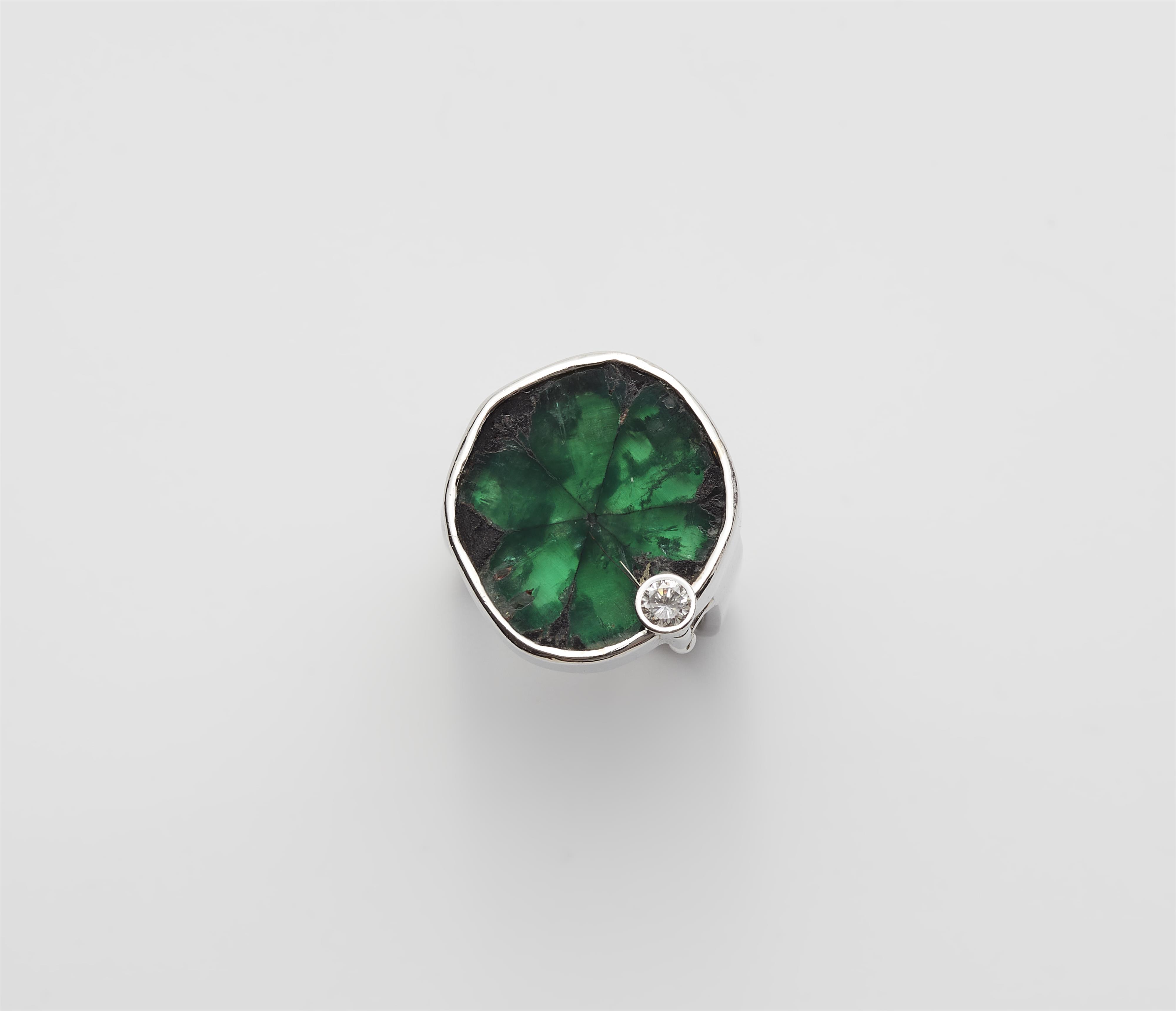 A German 18k white gold diamond ring with a rare 13.96 ct natural Columbian Trapiche emerald. - image-1