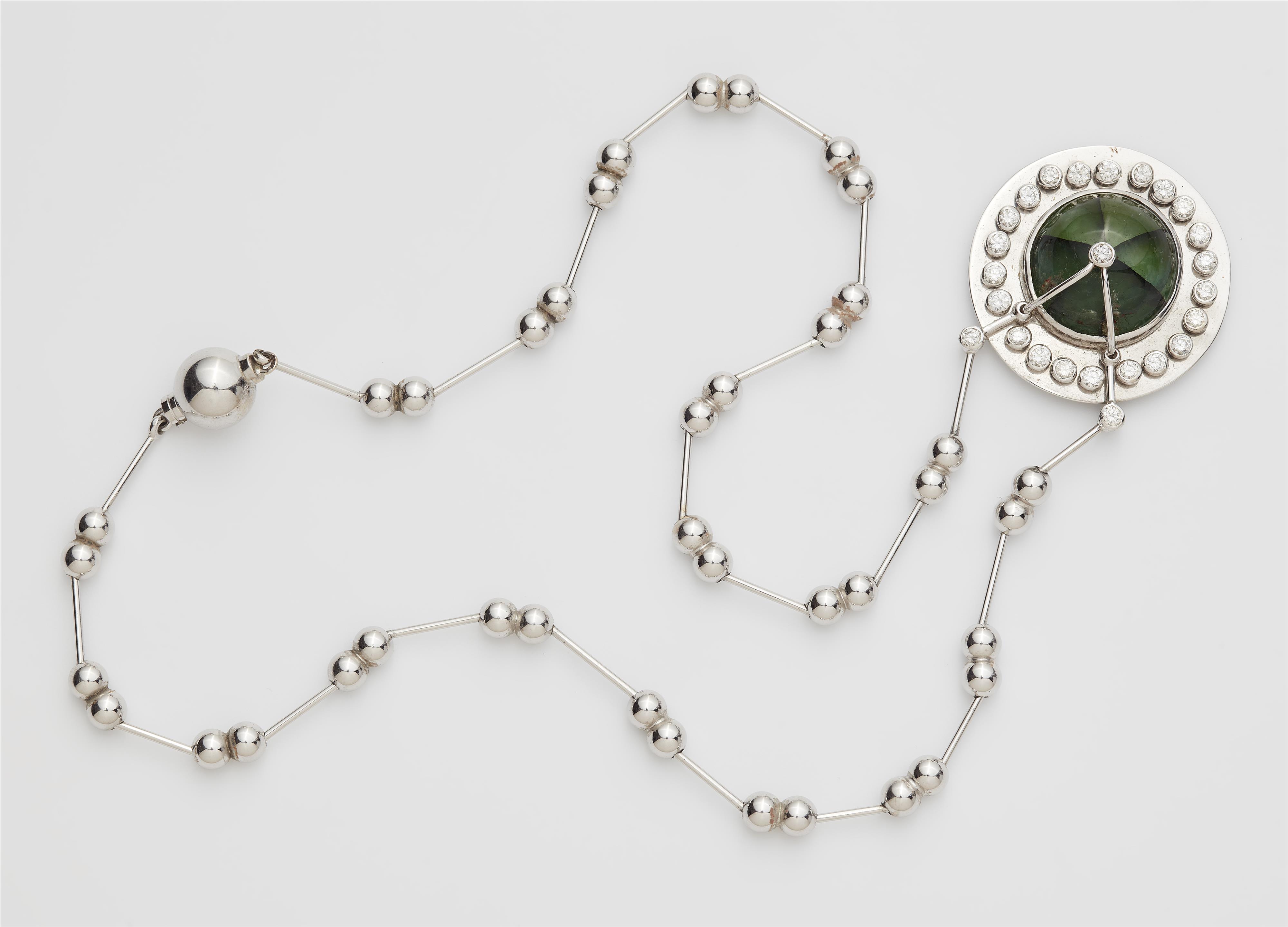 A German 18k white gold diamond pendant necklace with a rare 13,66 ct cabochon-cut natural Colombian Trapiche emerald. - image-1