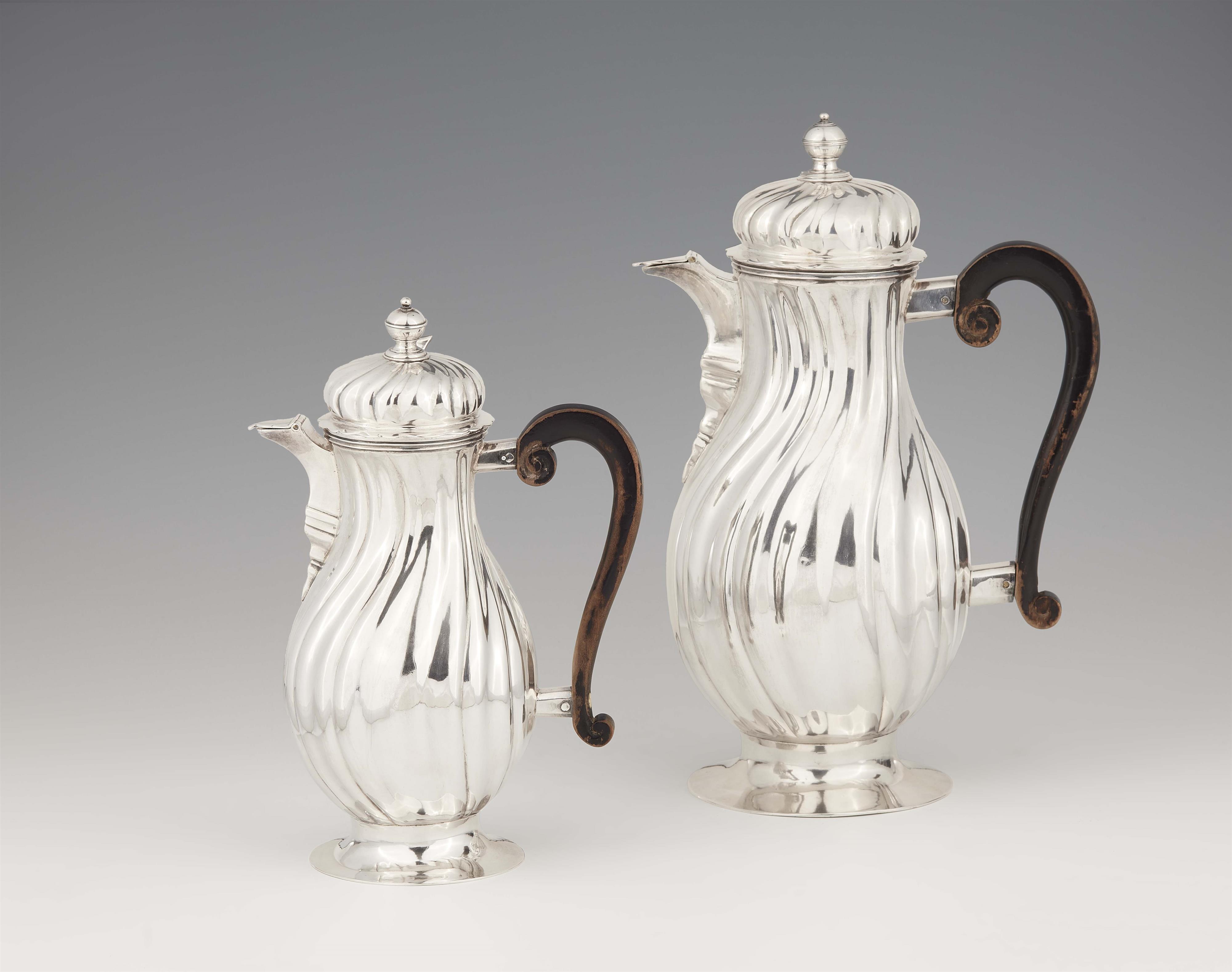 A pair of large Augsburg silver jugs - image-1