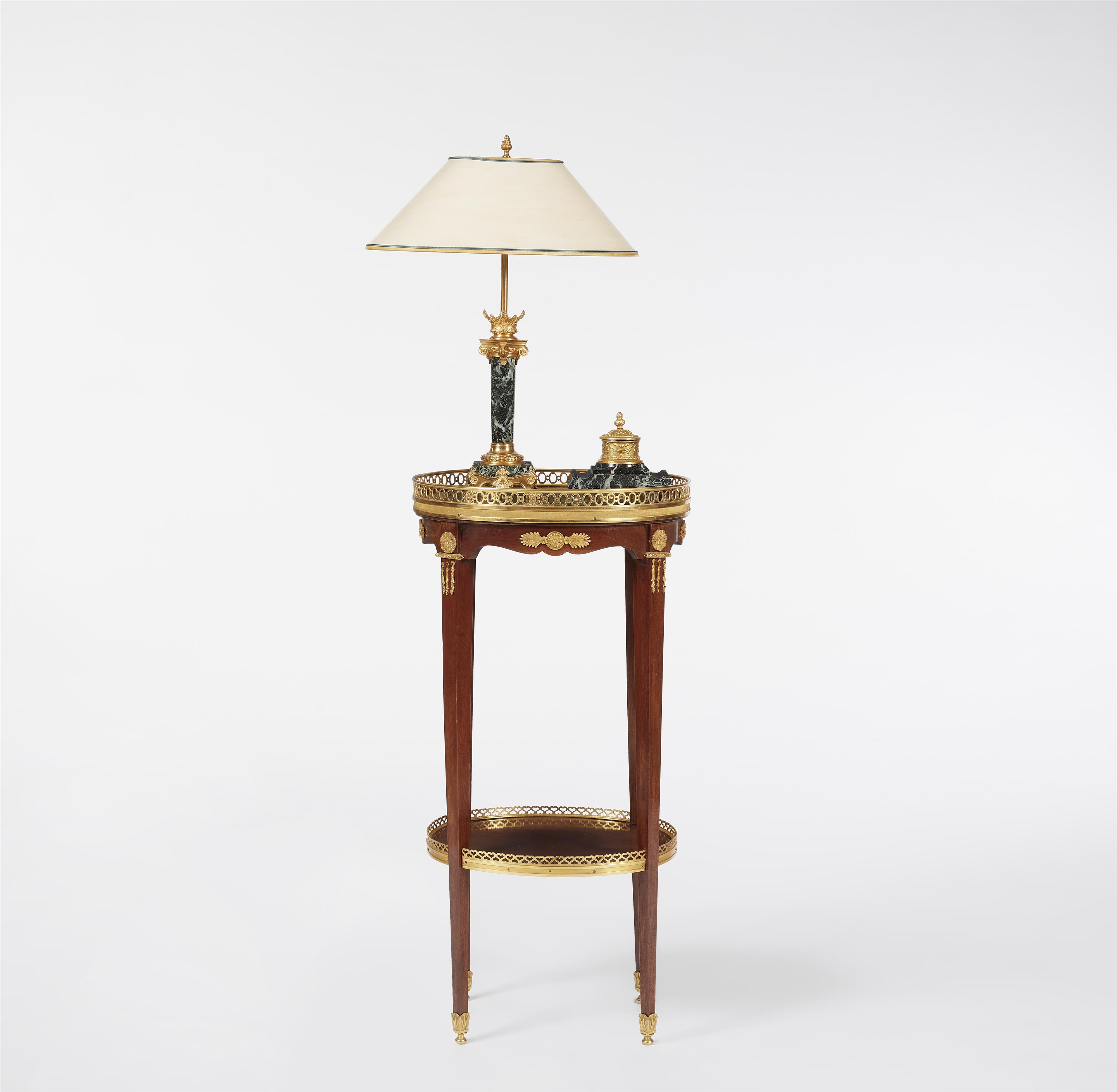 A mahogany gueridon with a table lamp and ink well - image-1
