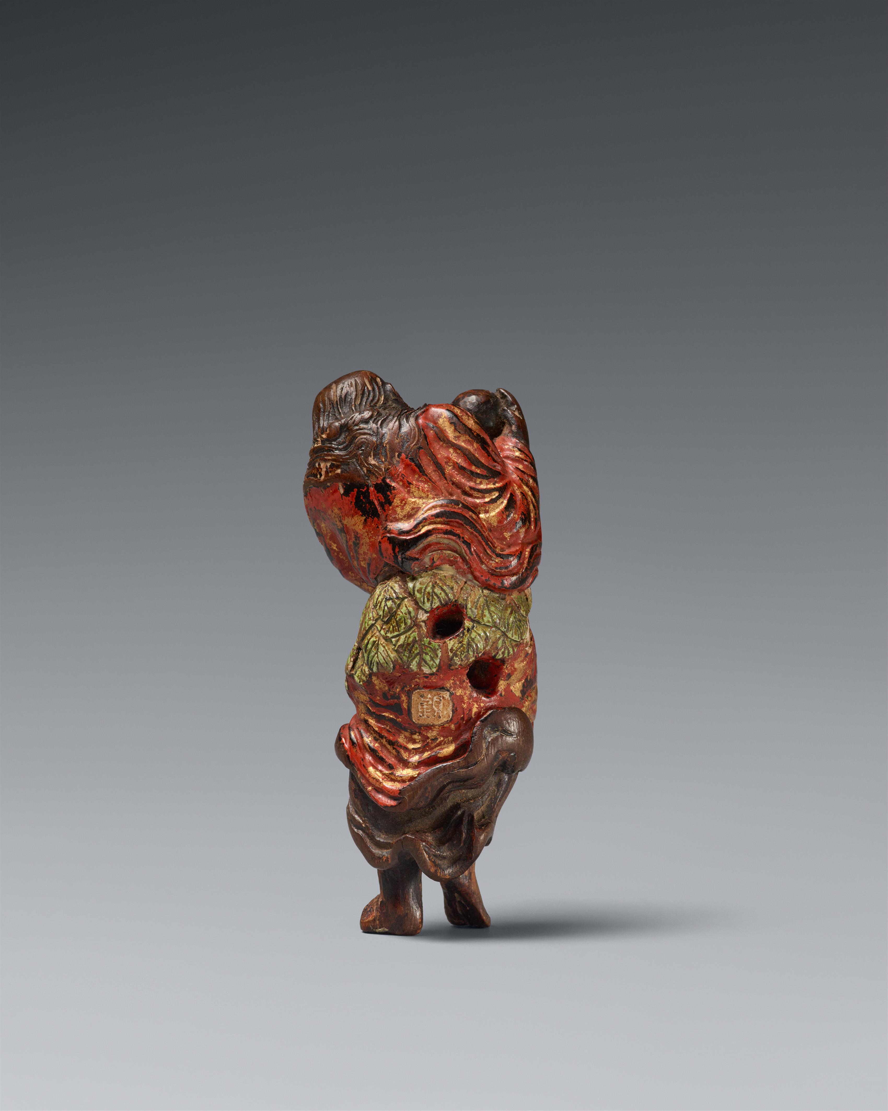 A rare lacquered and painted hinoki wood netsuke of an old sennin. Mid-18th century - image-2