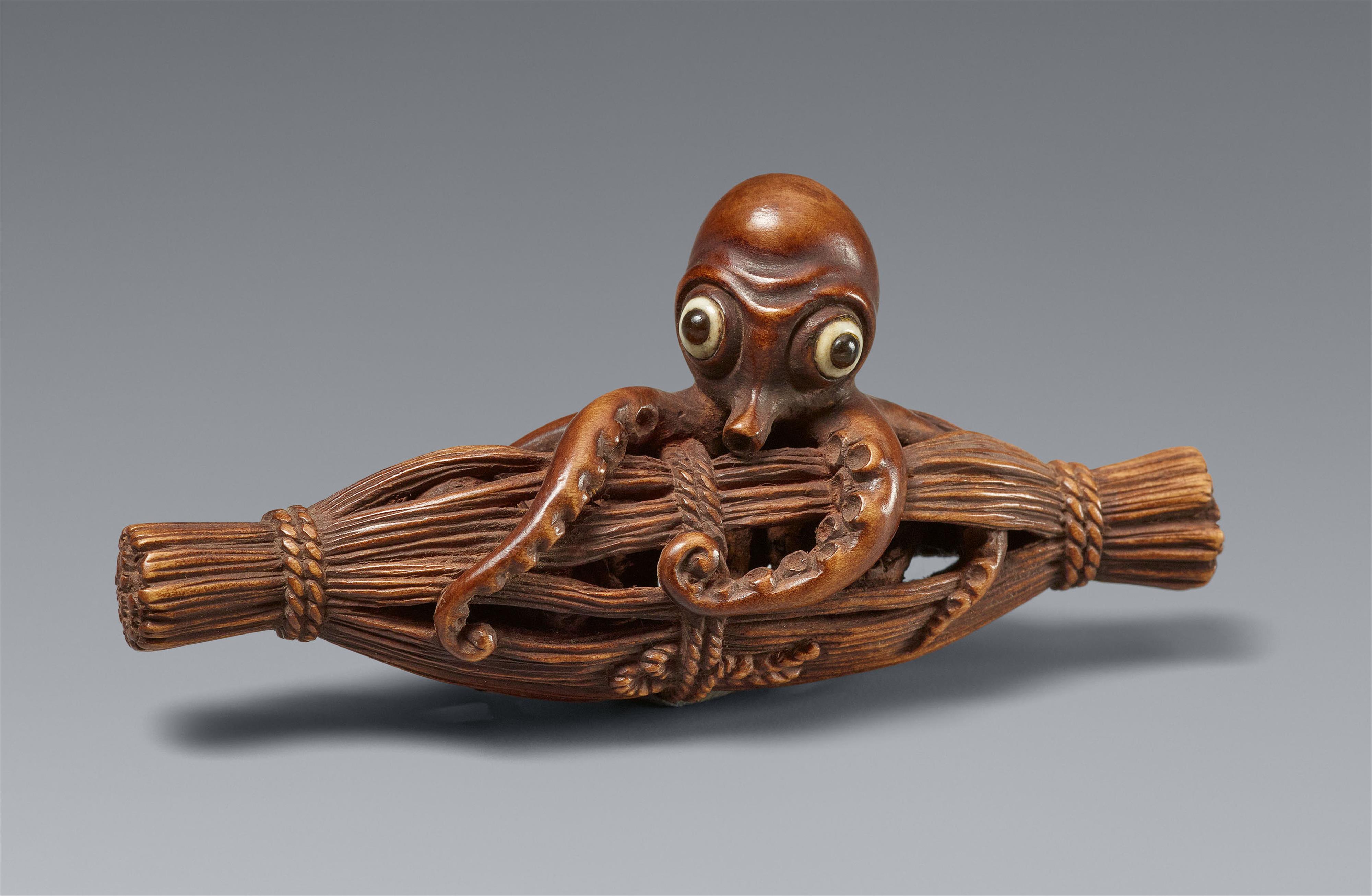 A boxwood netsuke of an octopus in a bundle. Nagoya. Ca. 1850-1880 - image-1