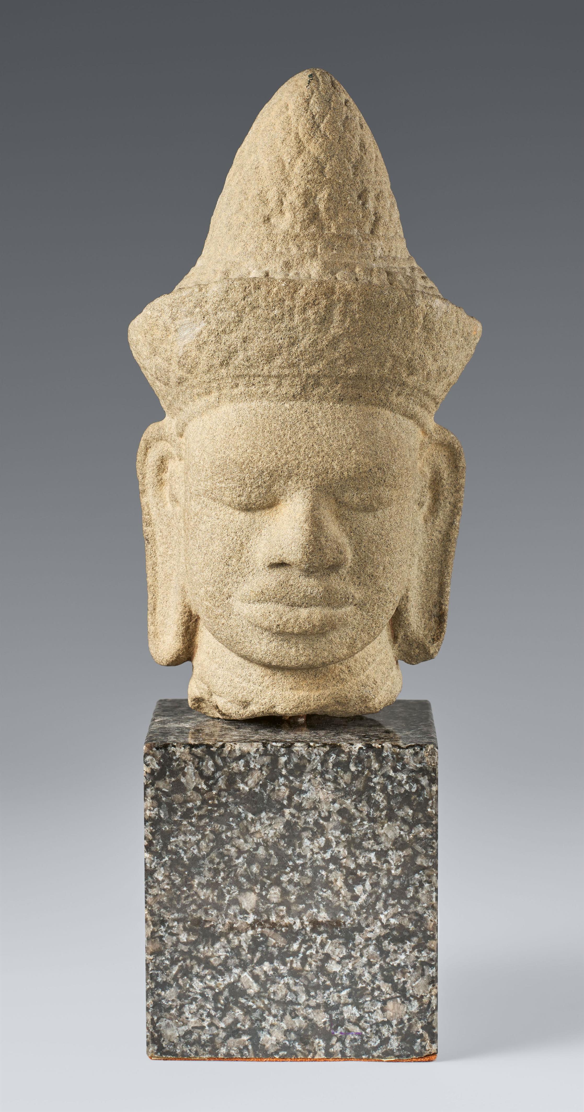 A Cambodian sandstone head of a deity. - image-1
