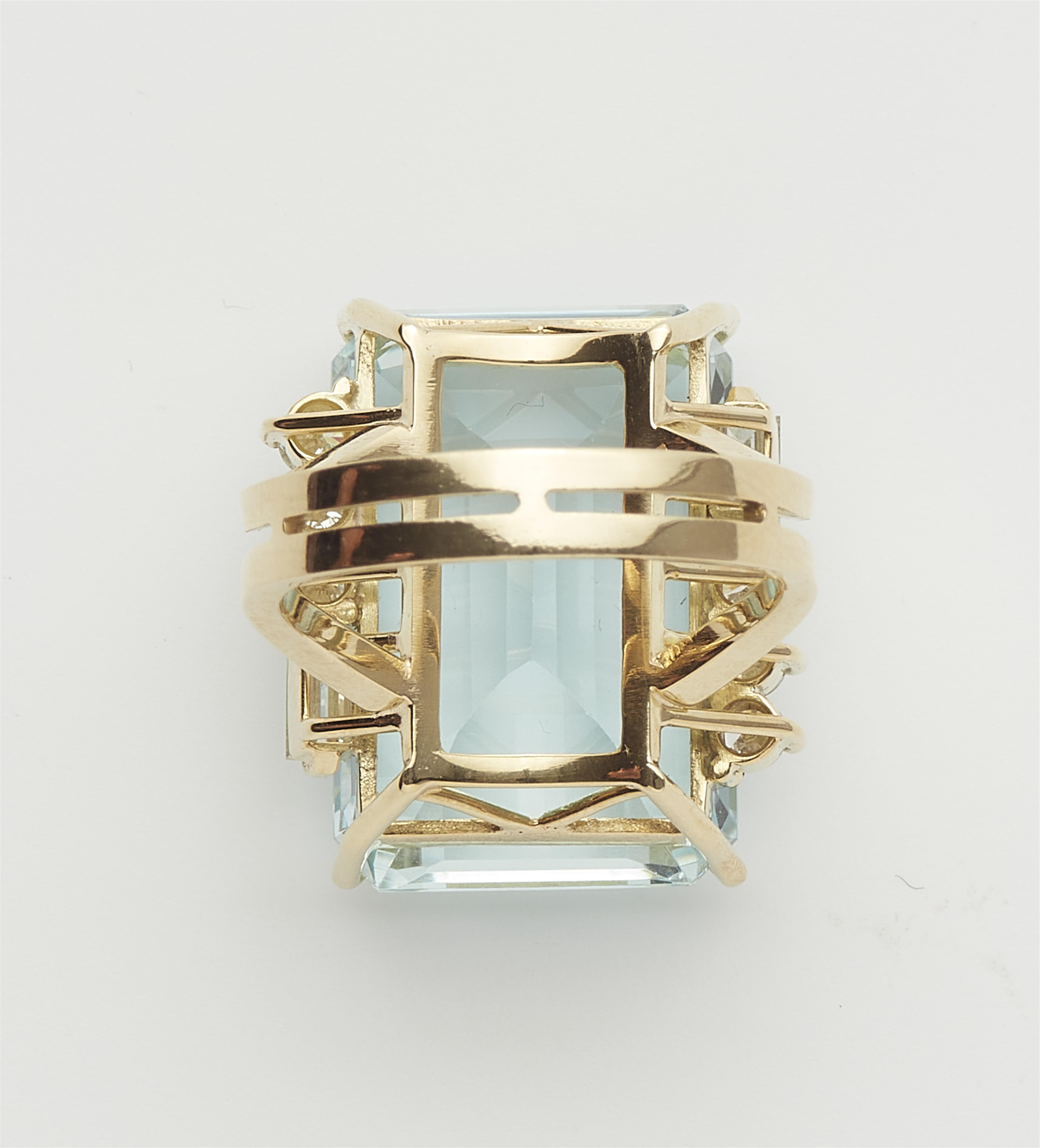 An 18k gold diamond and step-cut natural aquamarine ring. - image-3