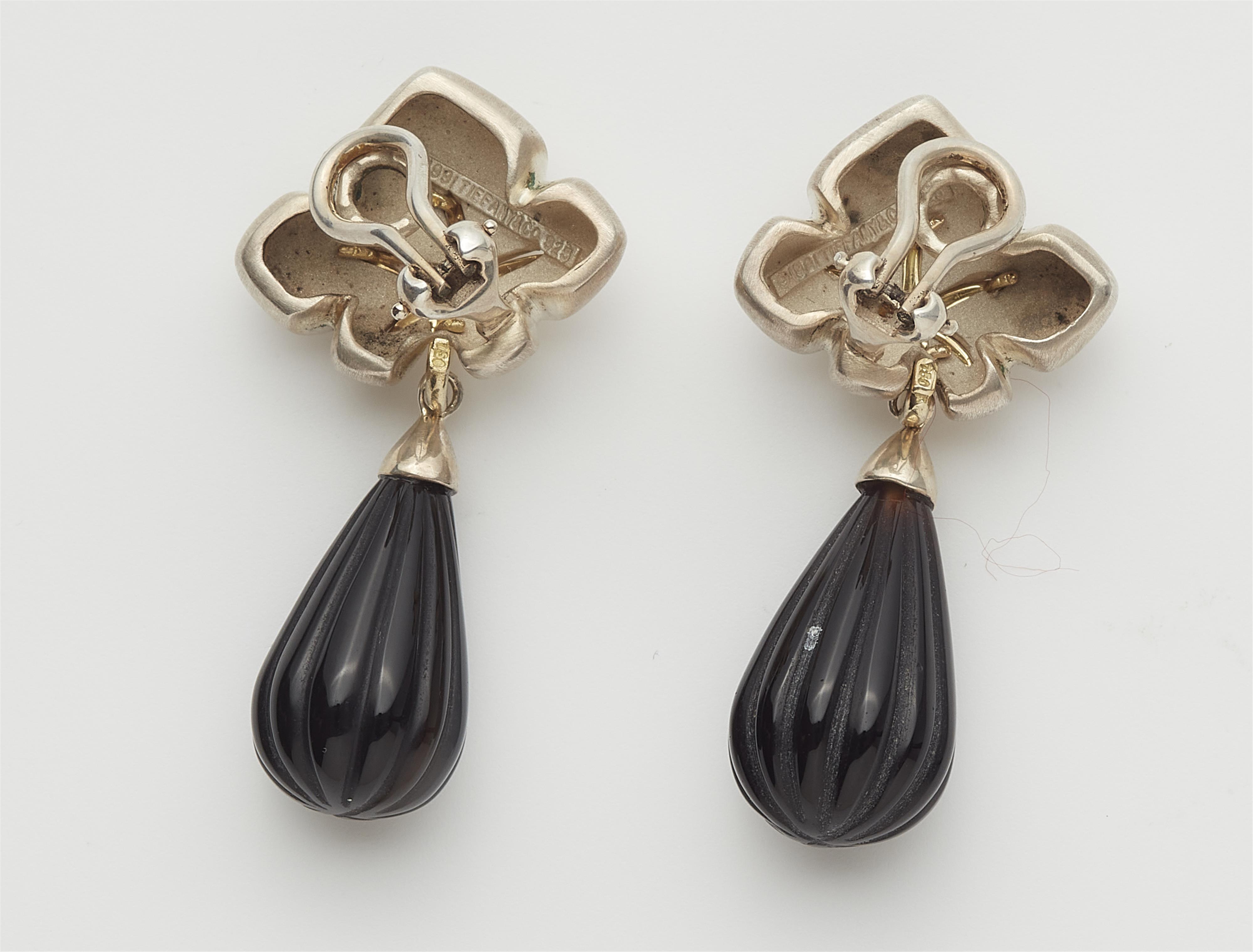 A pair of sterling silver, 18k gold and onyx "Ivy Starfish" clip earrings. - image-2