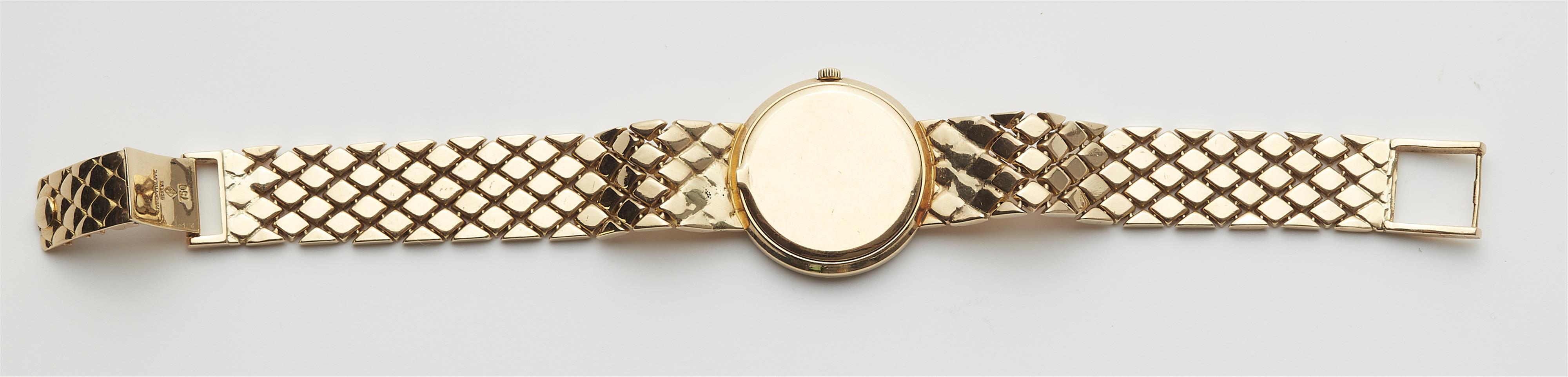 An 18k yellow gold and diamond Patek Philippe ladies quartz wristwatch. - image-2