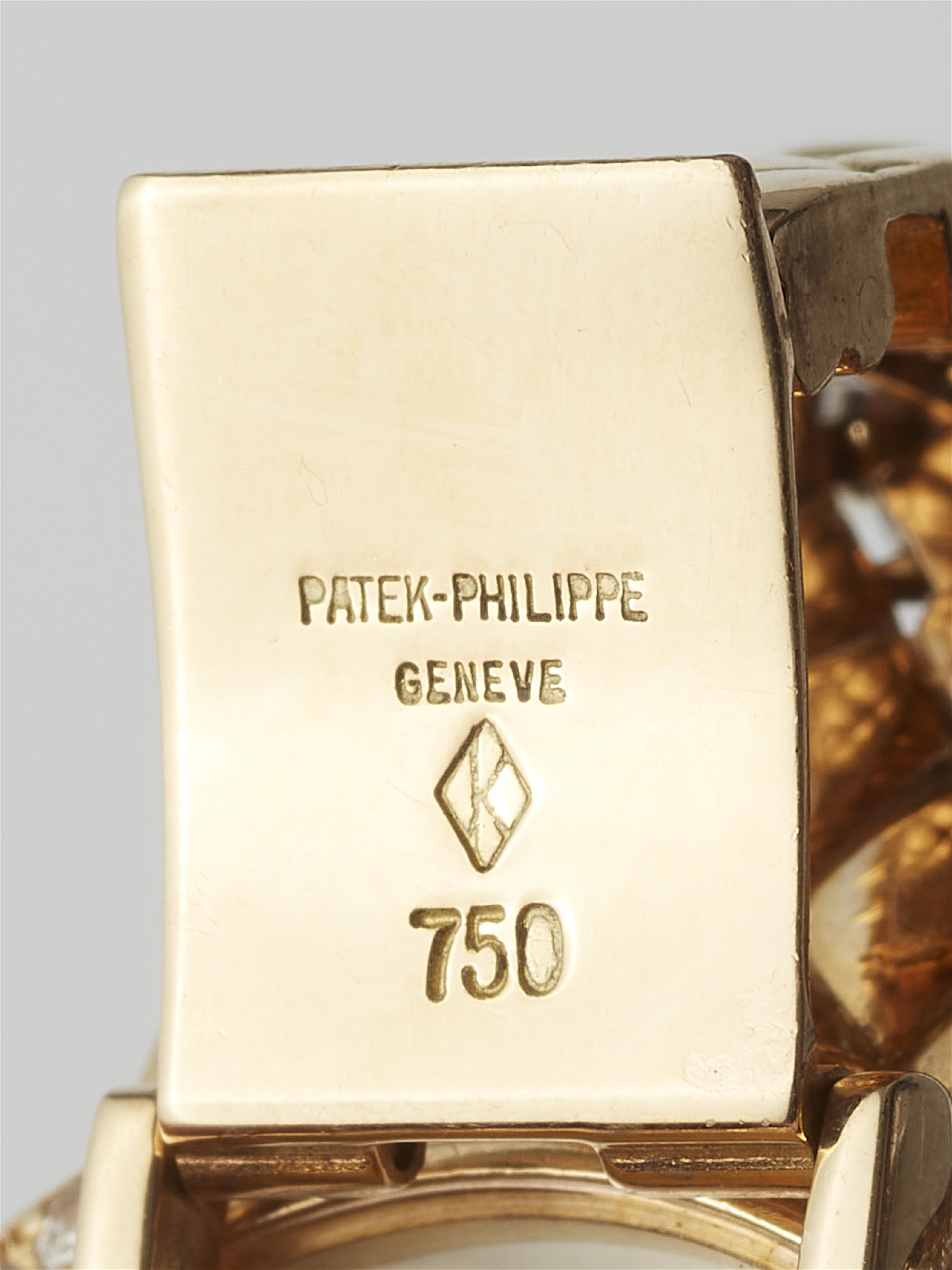 An 18k yellow gold and diamond Patek Philippe ladies quartz wristwatch. - image-3