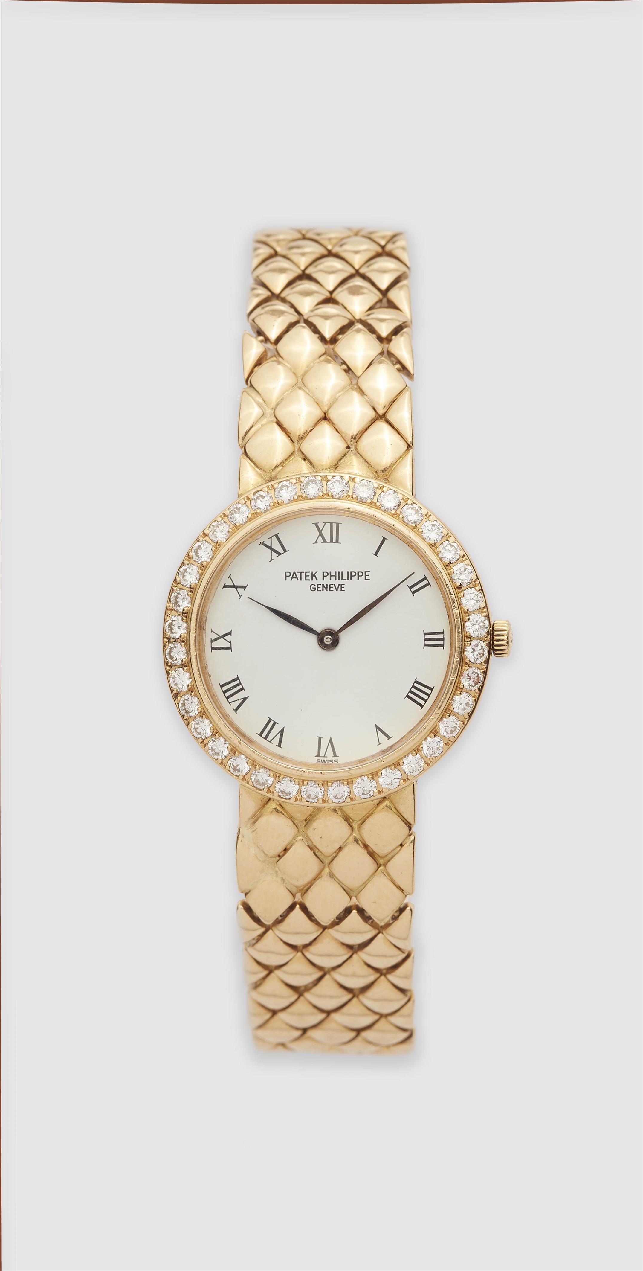 An 18k yellow gold and diamond Patek Philippe ladies quartz wristwatch. - image-1